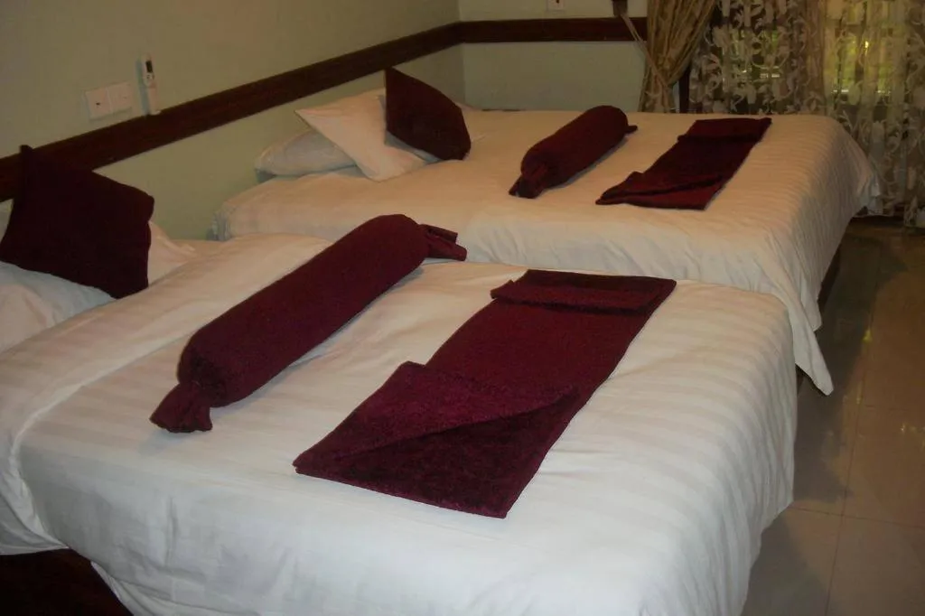 Bed in The Charity Hotel International
