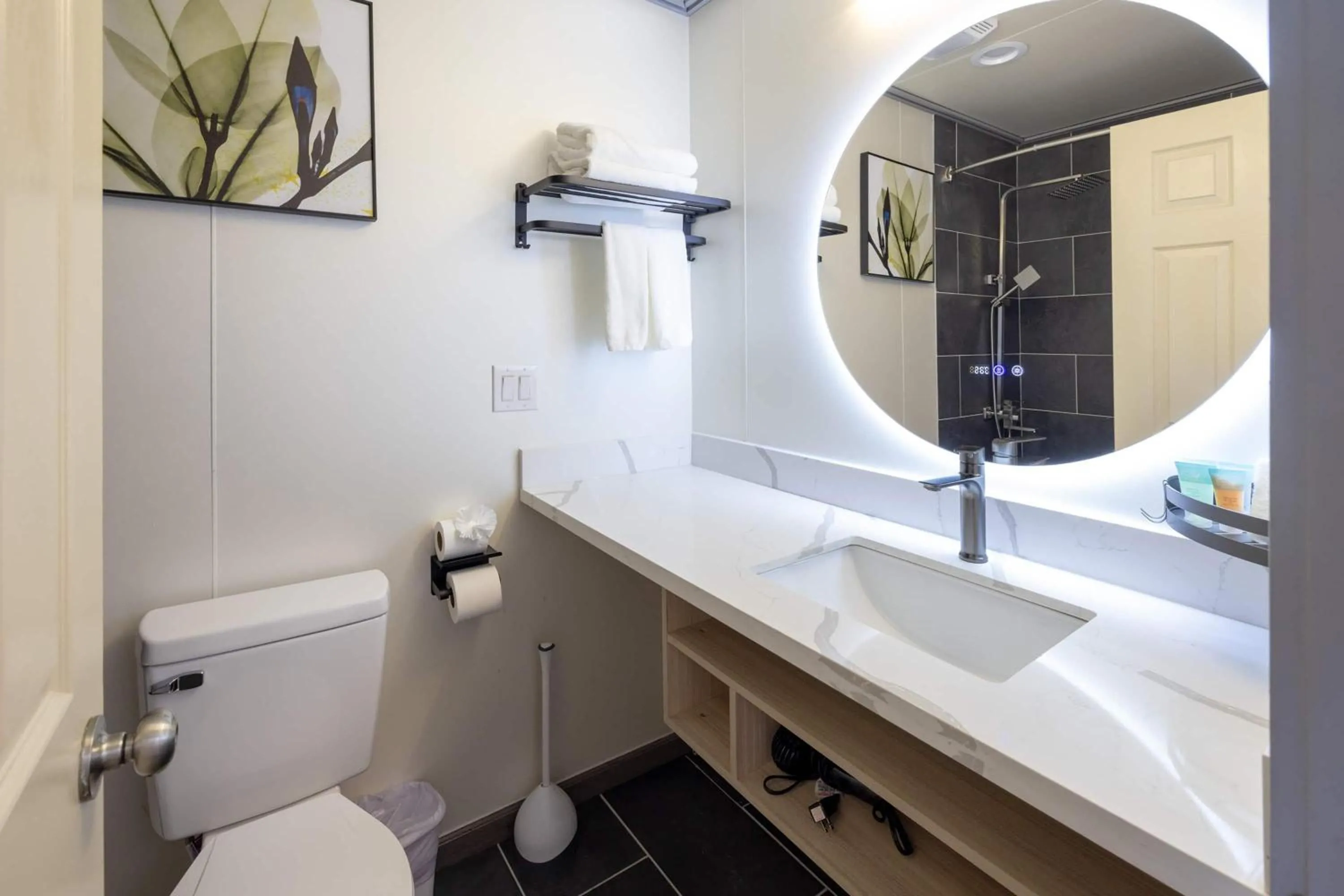 Bathroom in Interurban Suites Hotel, a Dazzler Select by Wyndham