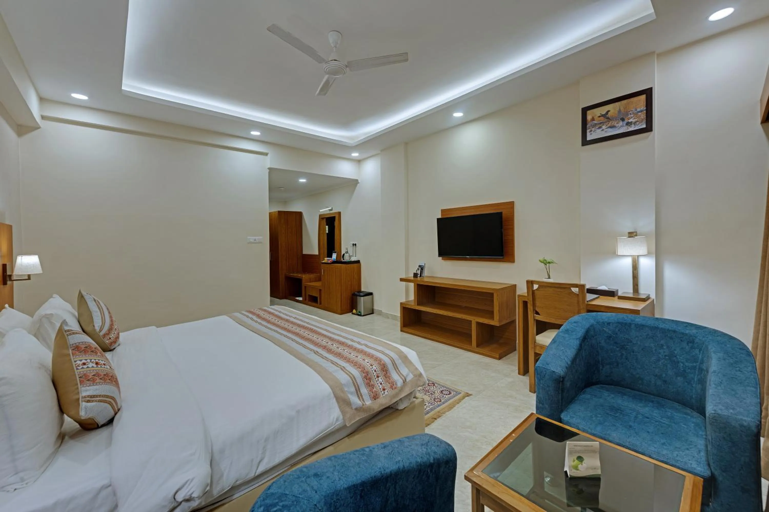 Seating area, Bed in The Fern Residency, Bodhgaya, Series by Marriott