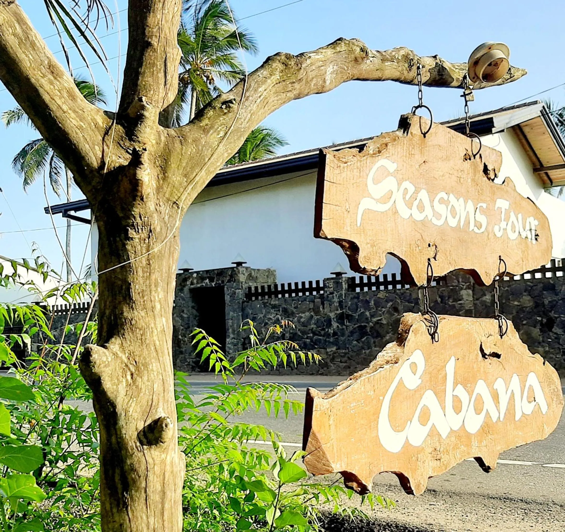 Property logo or sign in Seasons Four Mini Jungle Cabana