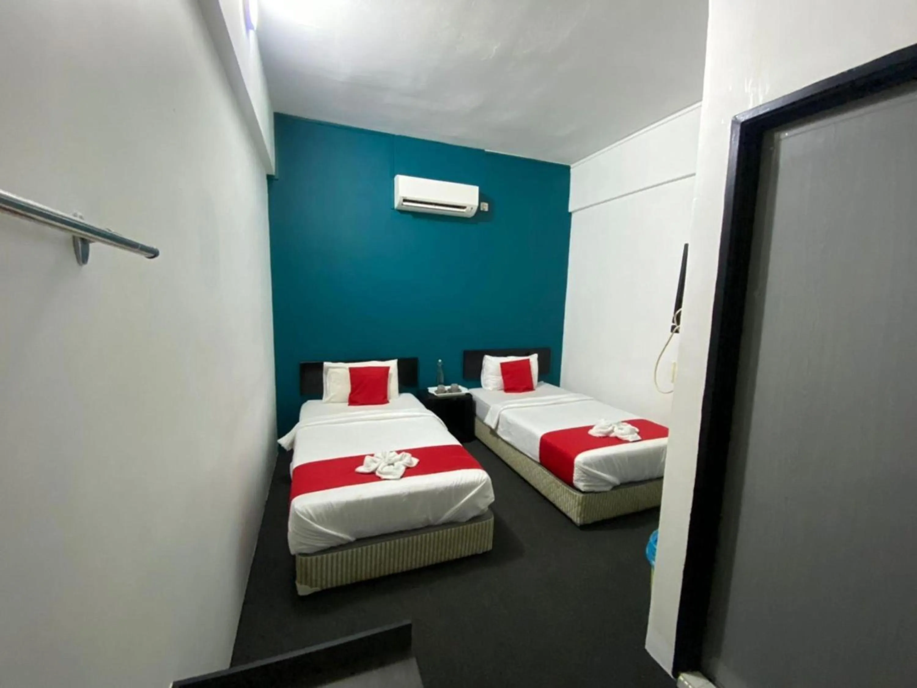 Bedroom in Hotel O Captain Hotel Cafe & Bistro