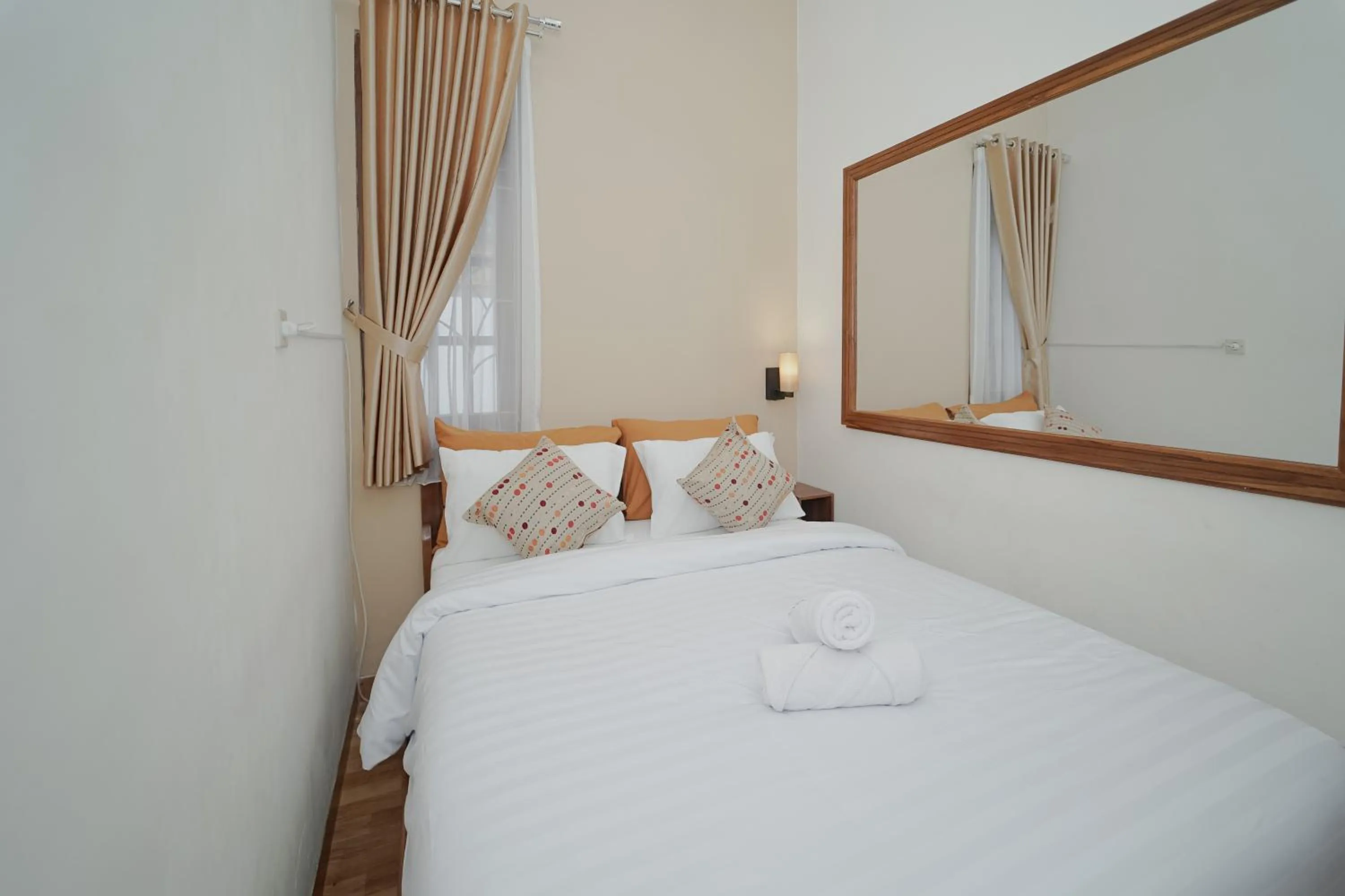 Bed in Villa D'Maguwo Suites