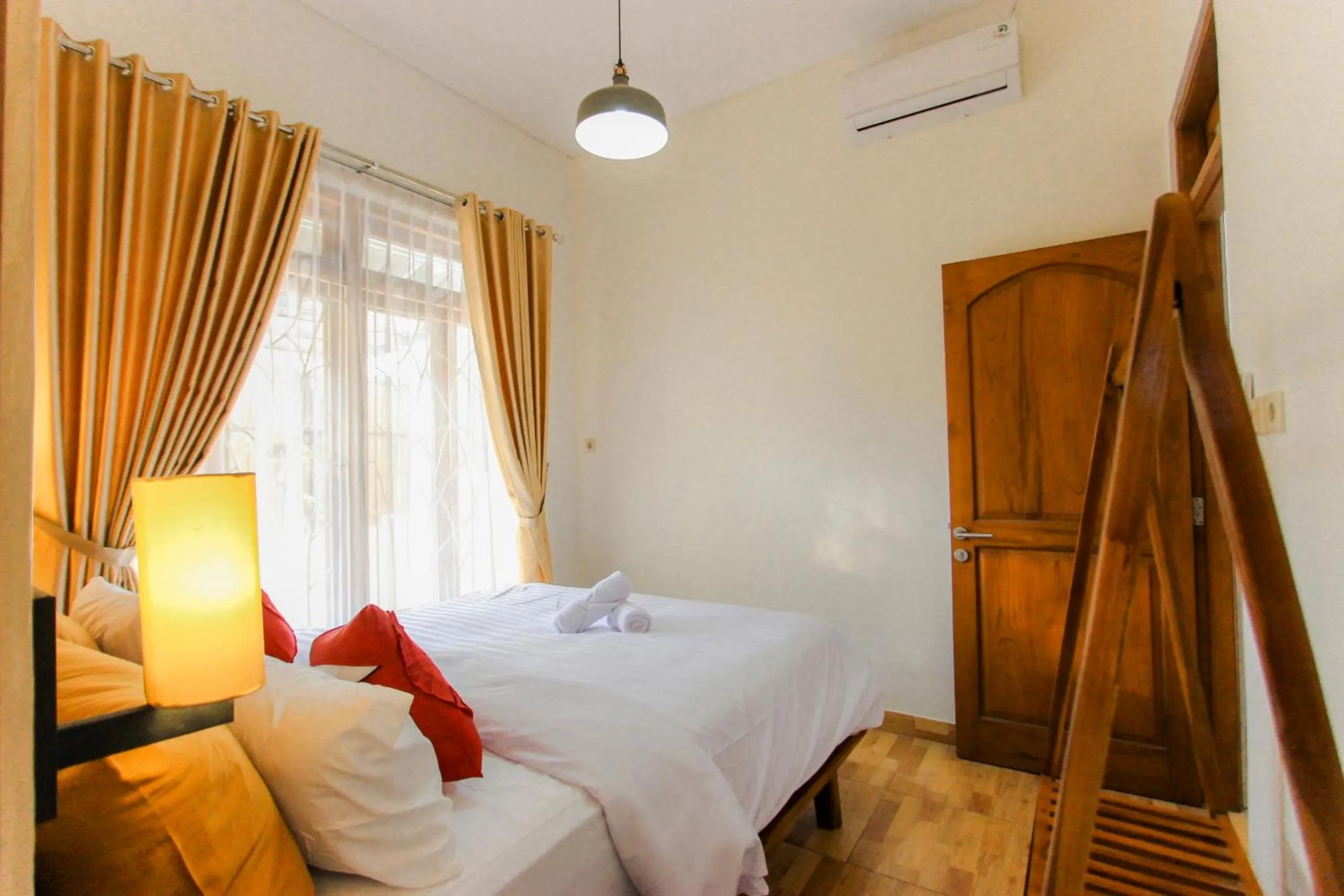 Bed in Villa D'Maguwo Suites