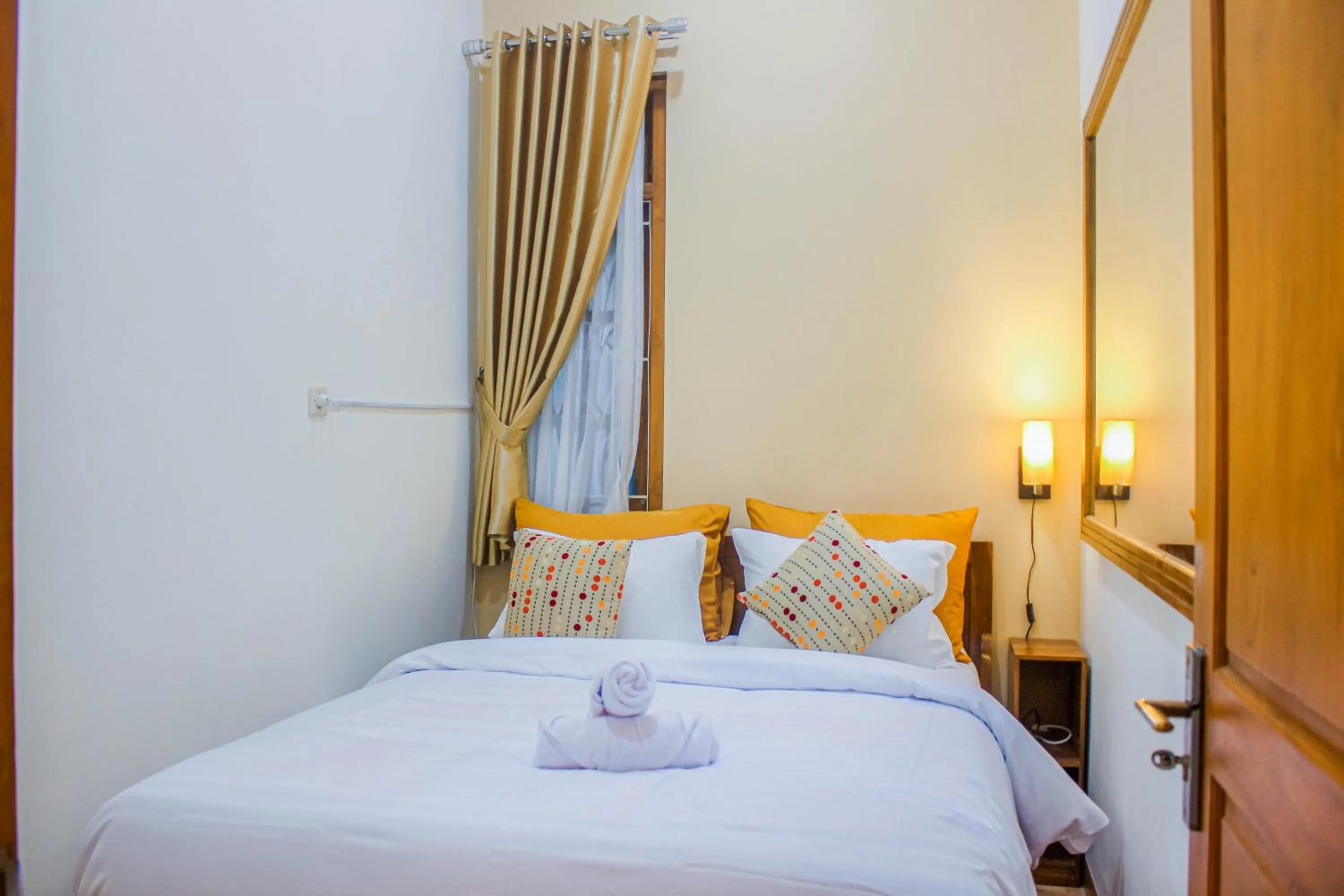 Bed in Villa D'Maguwo Suites