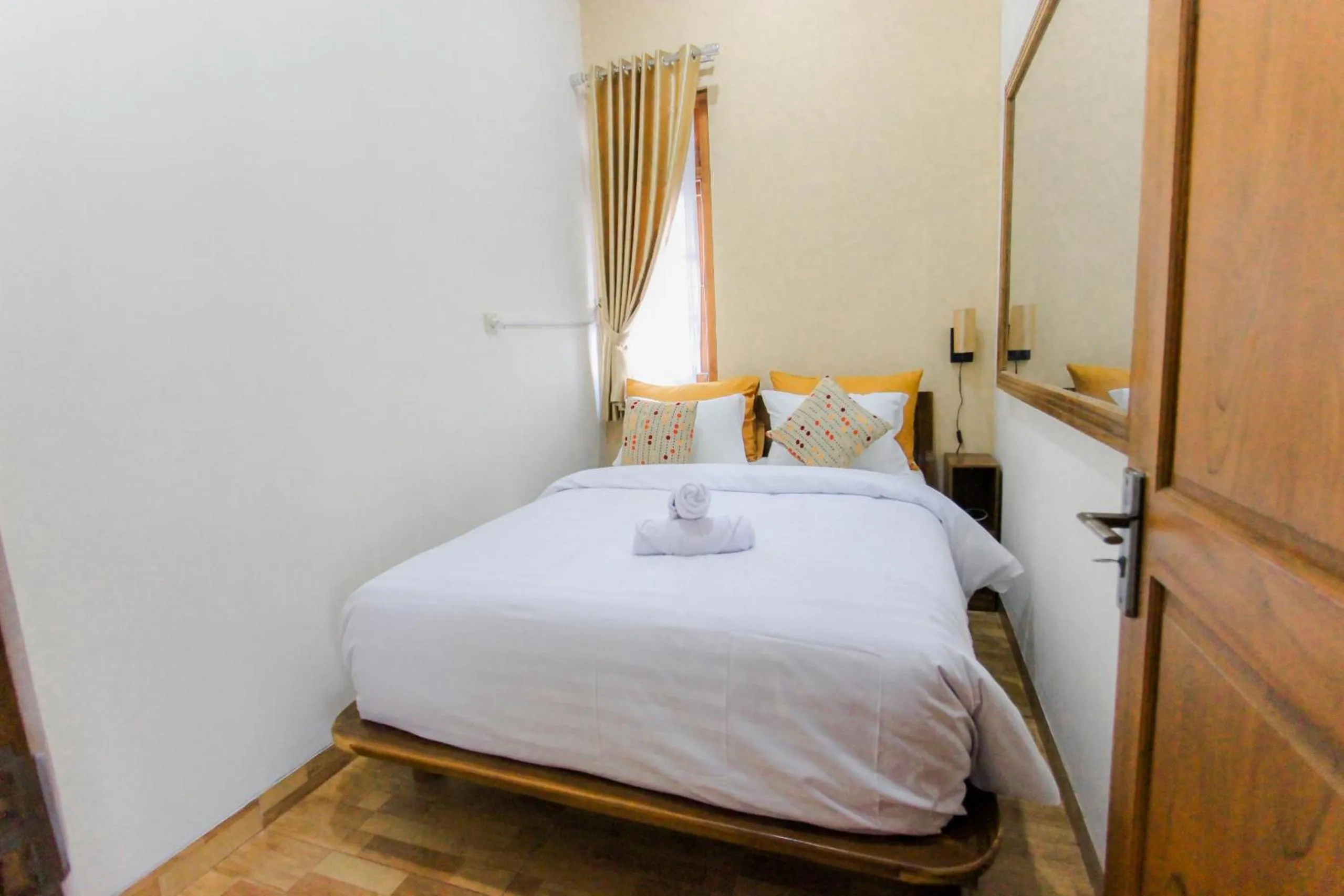 Bed in Villa D'Maguwo Suites