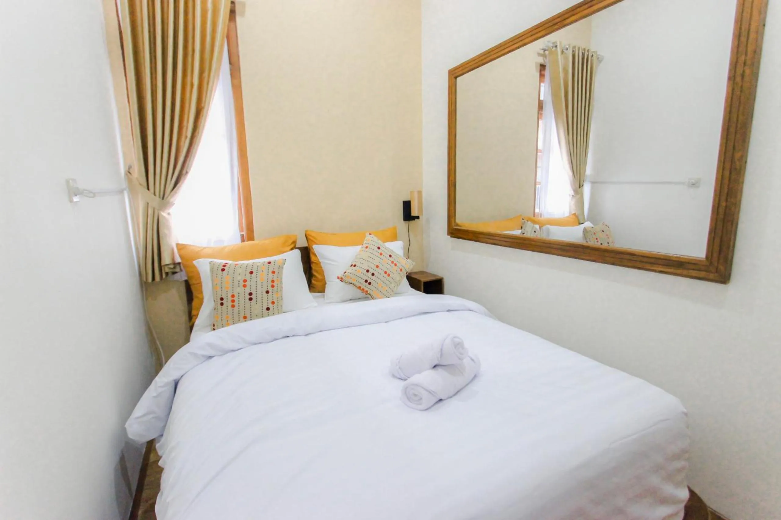 Bed in Villa D'Maguwo Suites