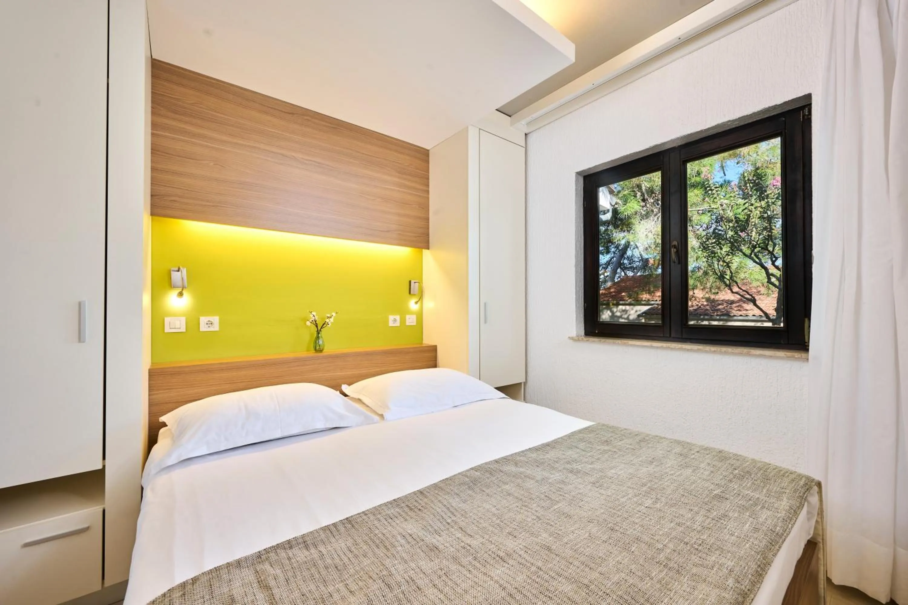 Bed in Apartments Galijot Plava Laguna