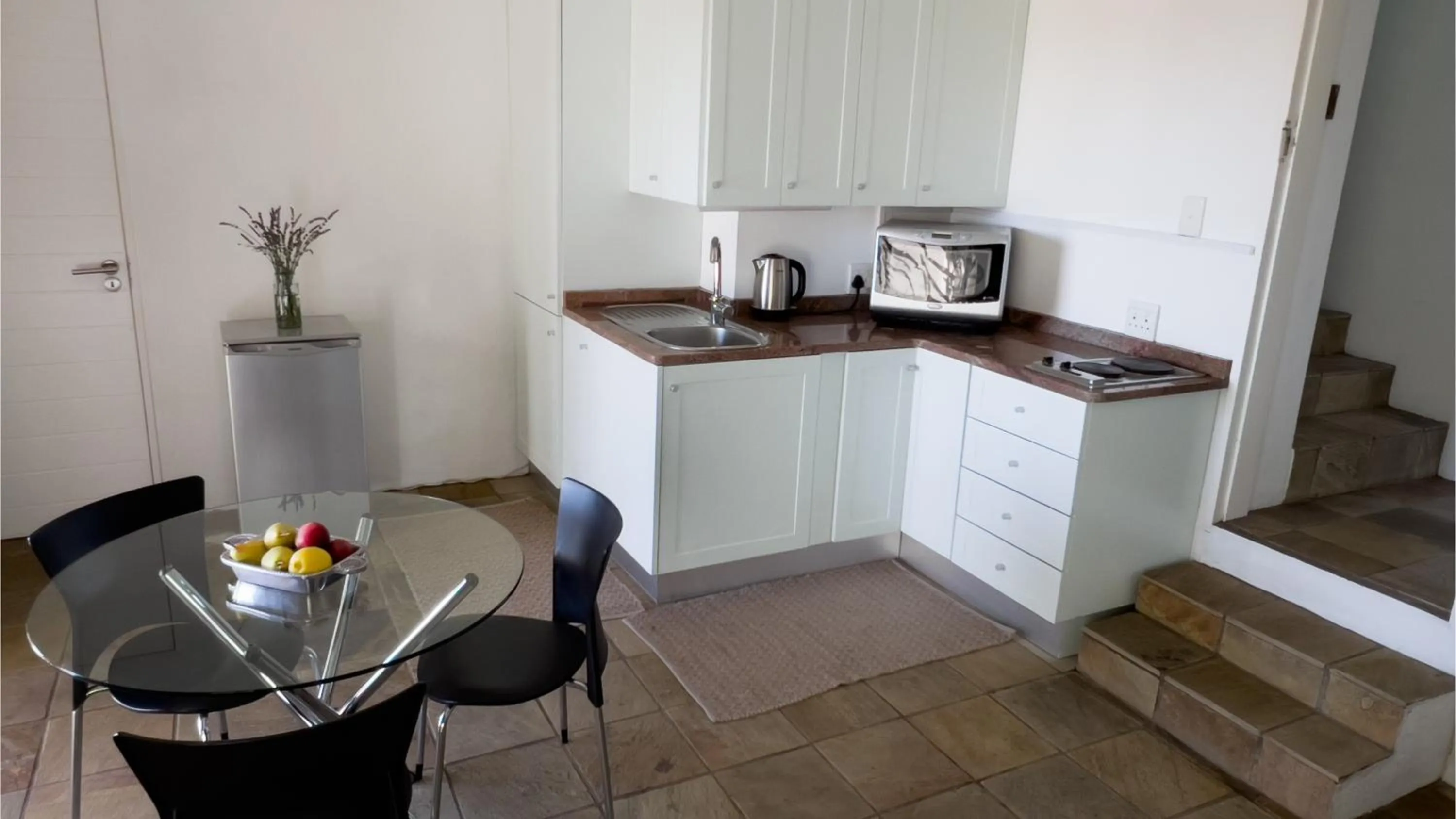 Kitchen or kitchenette in Orangerie Guest House