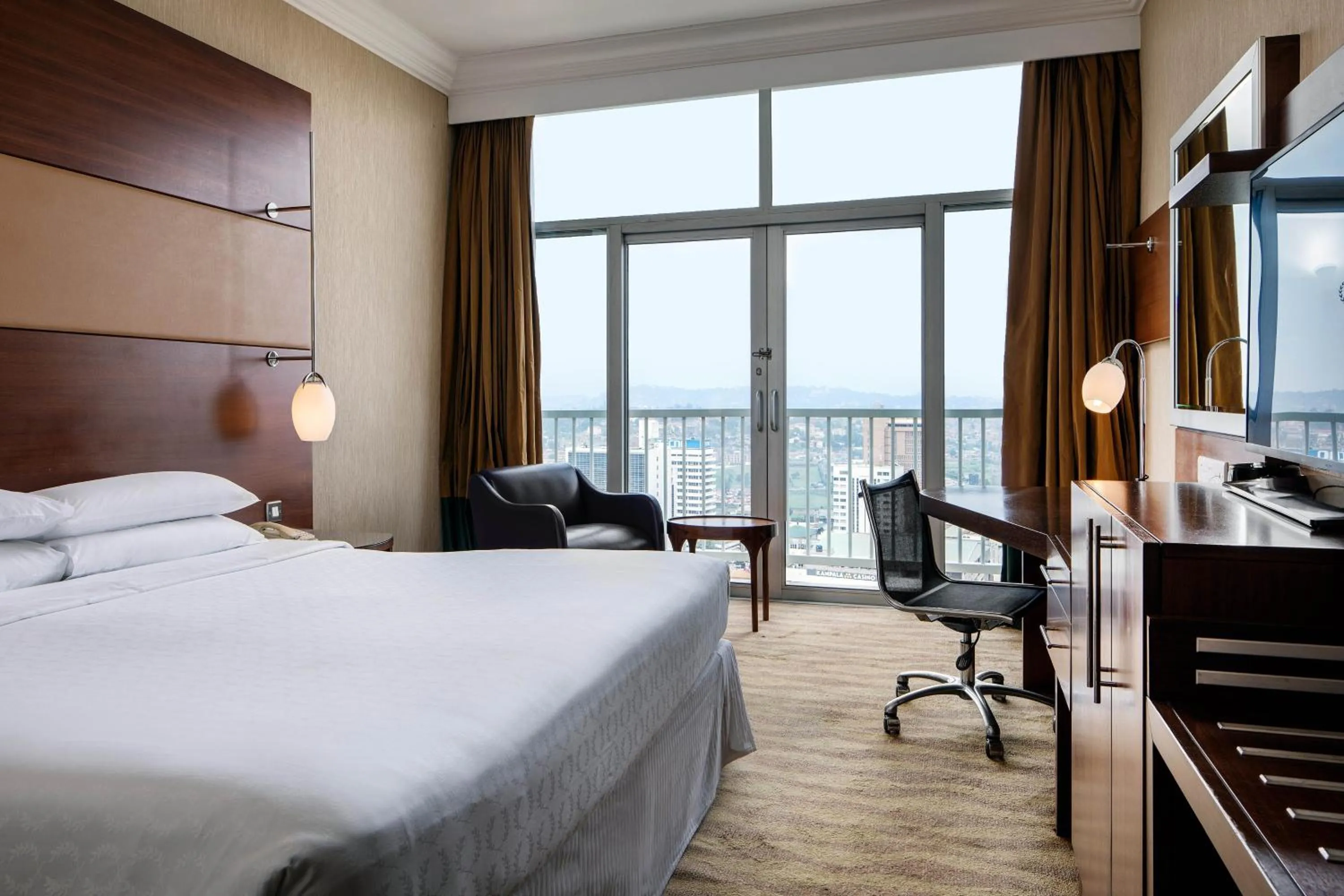 Photo of the whole room, Bed in Sheraton Kampala Hotel