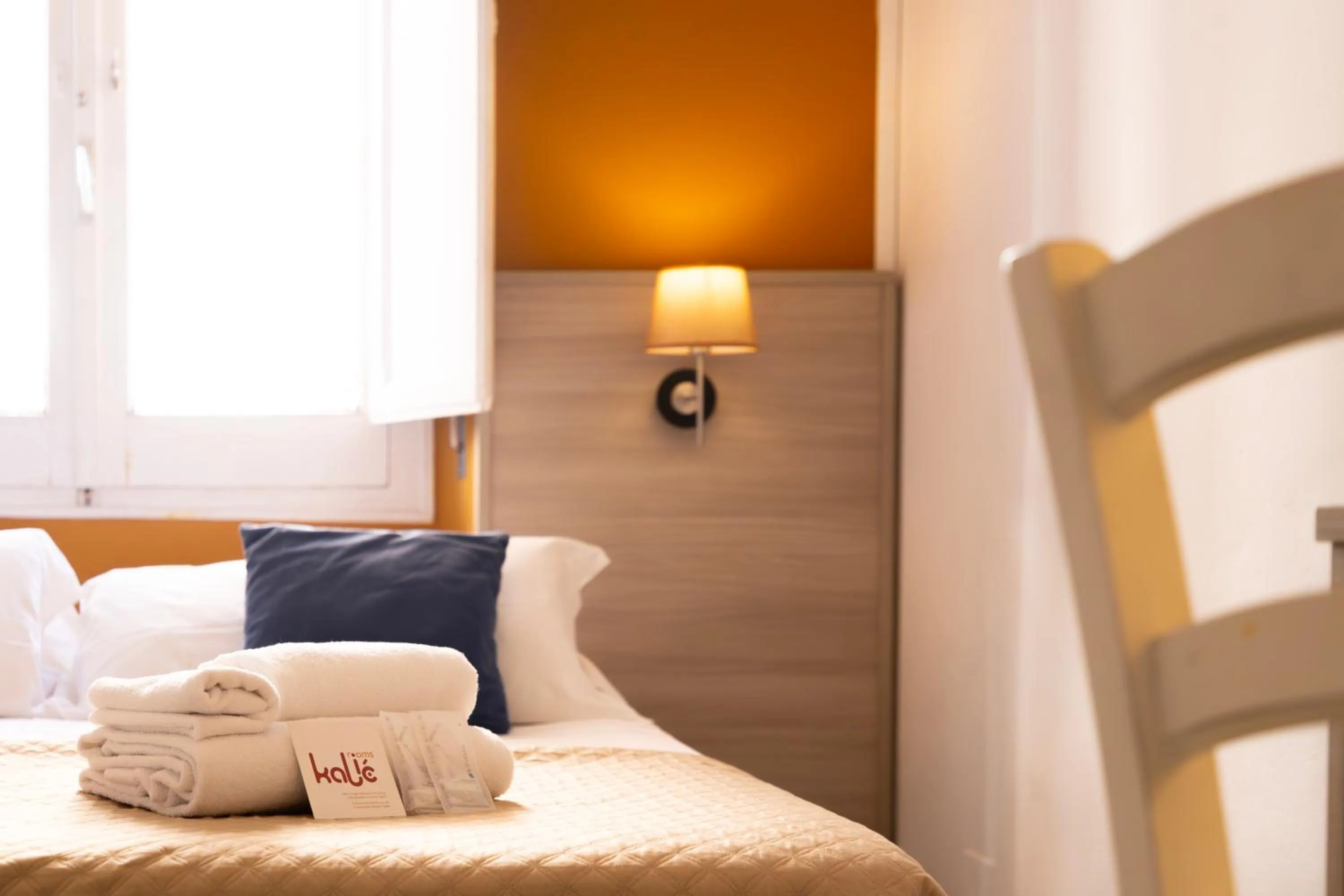 Bed in Kaliè Rooms Guest House