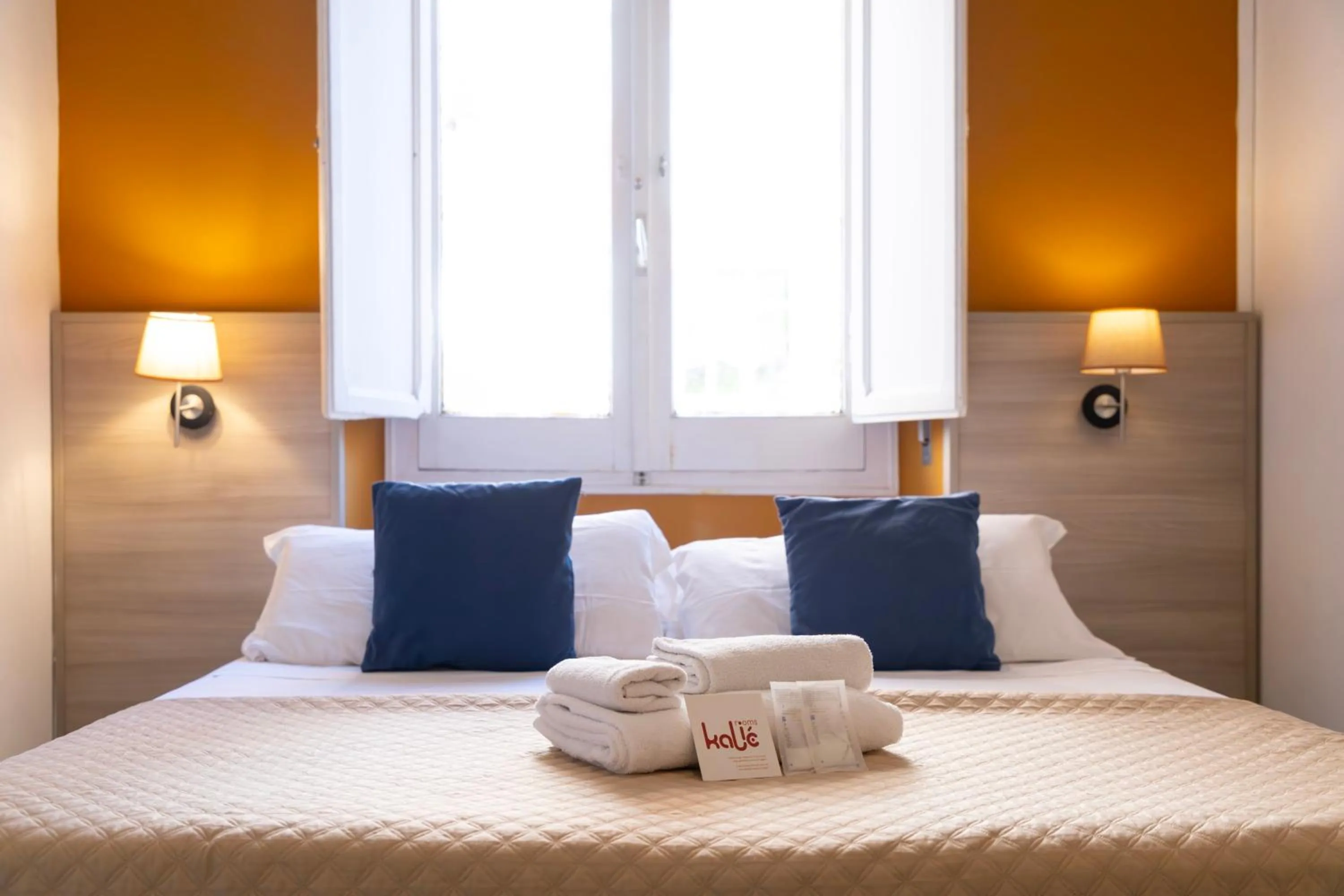 Bed in Kaliè Rooms Guest House