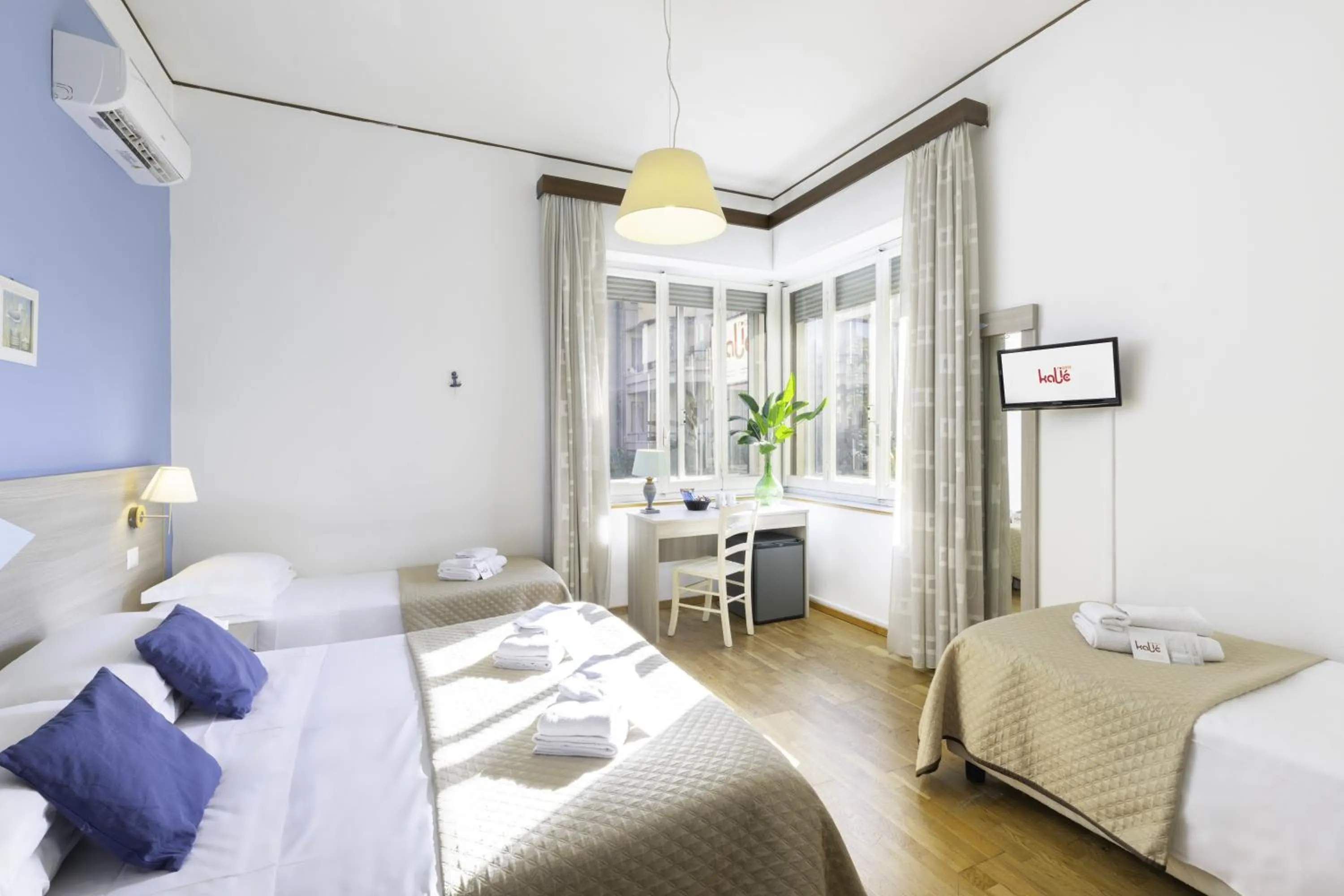 Bed in Kaliè Rooms Guest House