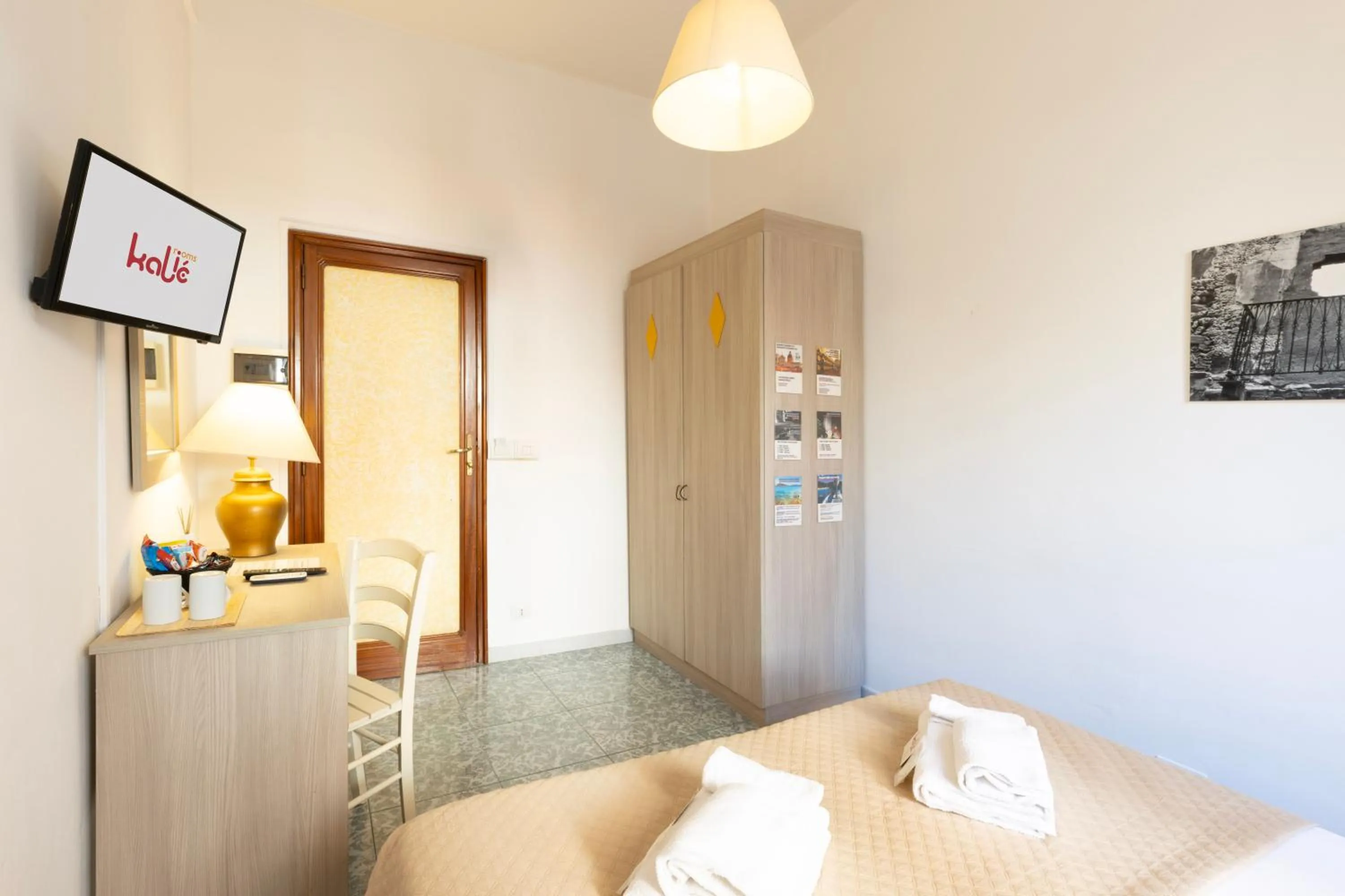 Bed in Kaliè Rooms Guest House