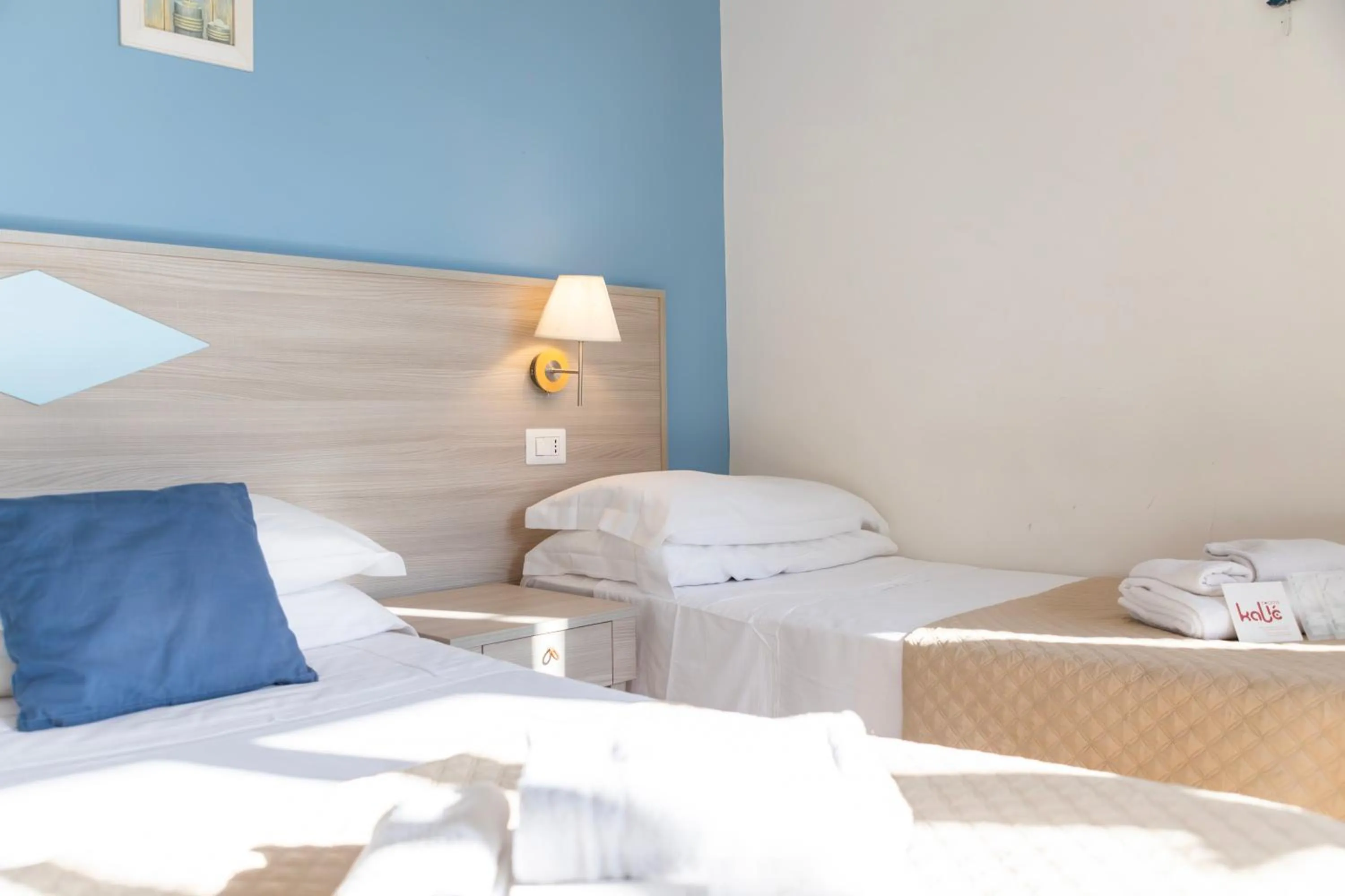 Bed in Kaliè Rooms Guest House