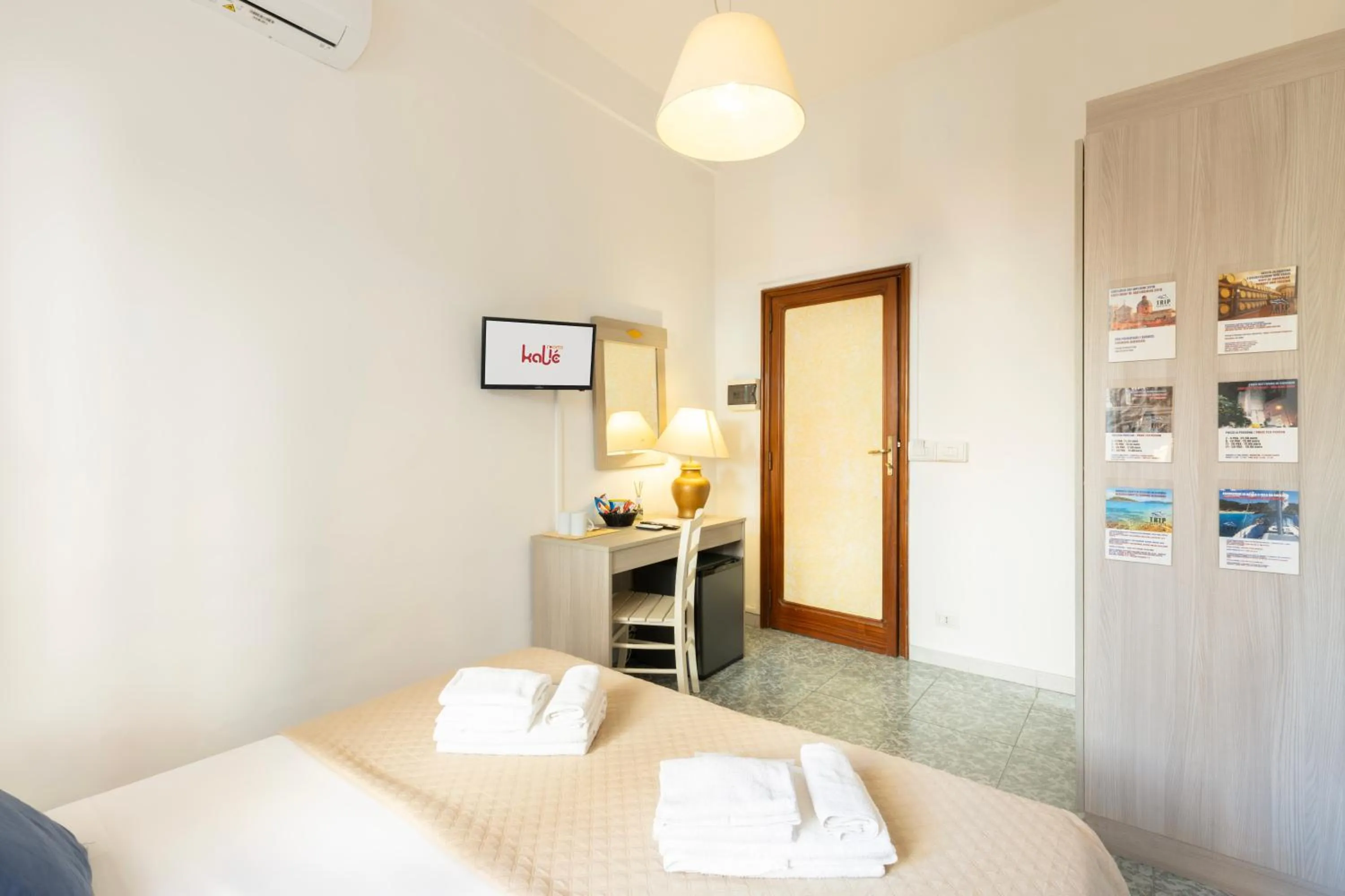 Bed in Kaliè Rooms Guest House