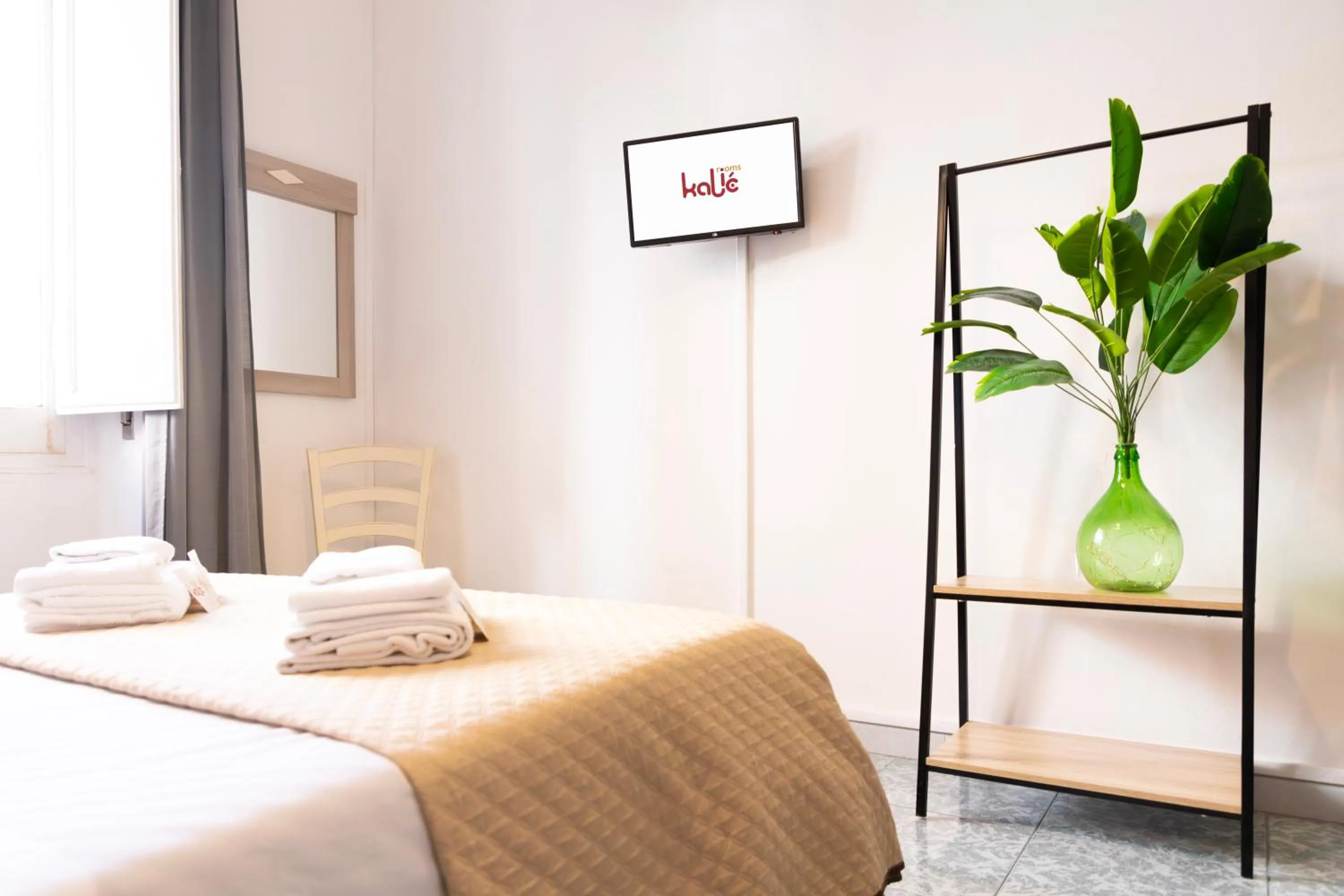 Bed in Kaliè Rooms Guest House