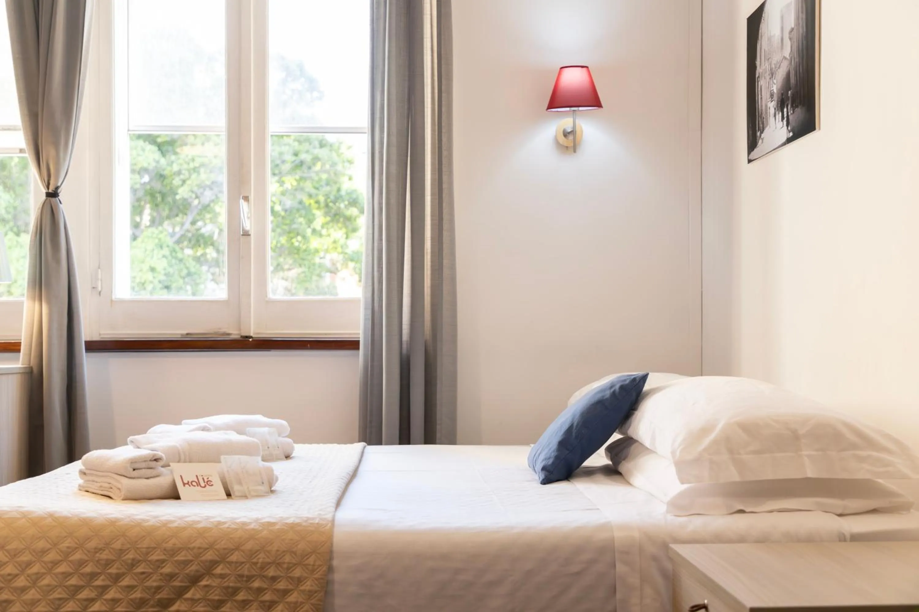 Bed in Kaliè Rooms Guest House