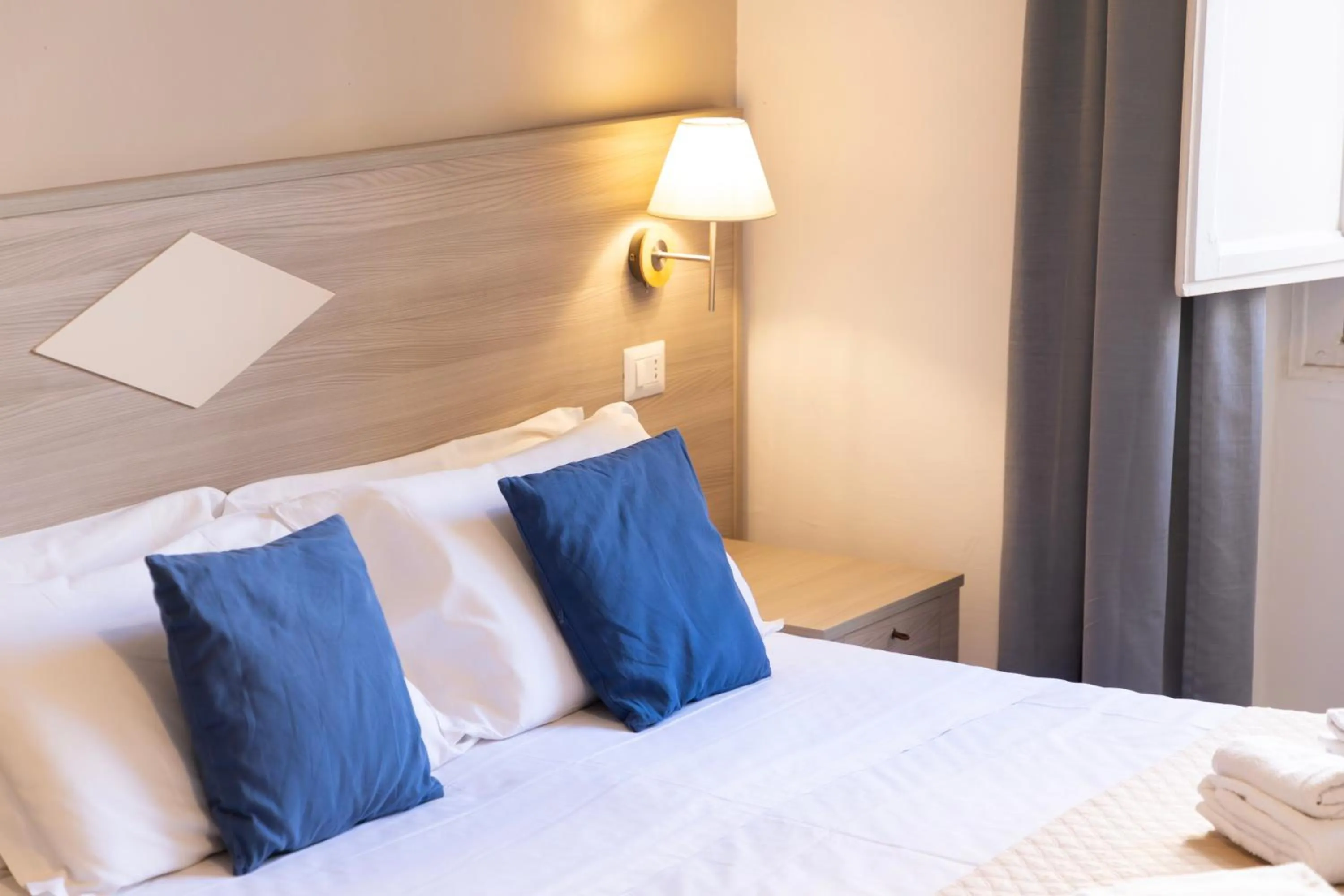 Bed in Kaliè Rooms Guest House