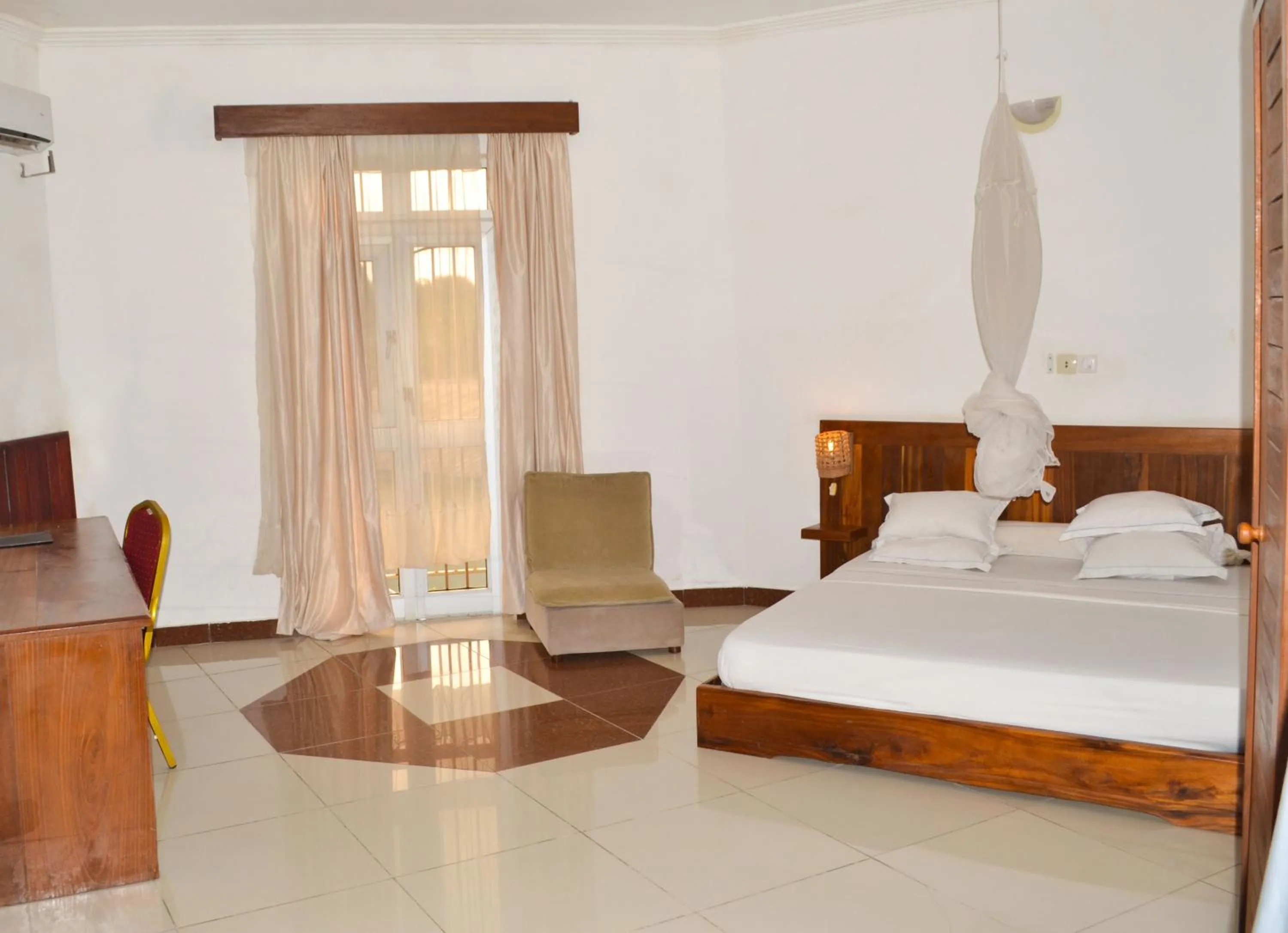 Bed in Hôtel Framotel Kribi