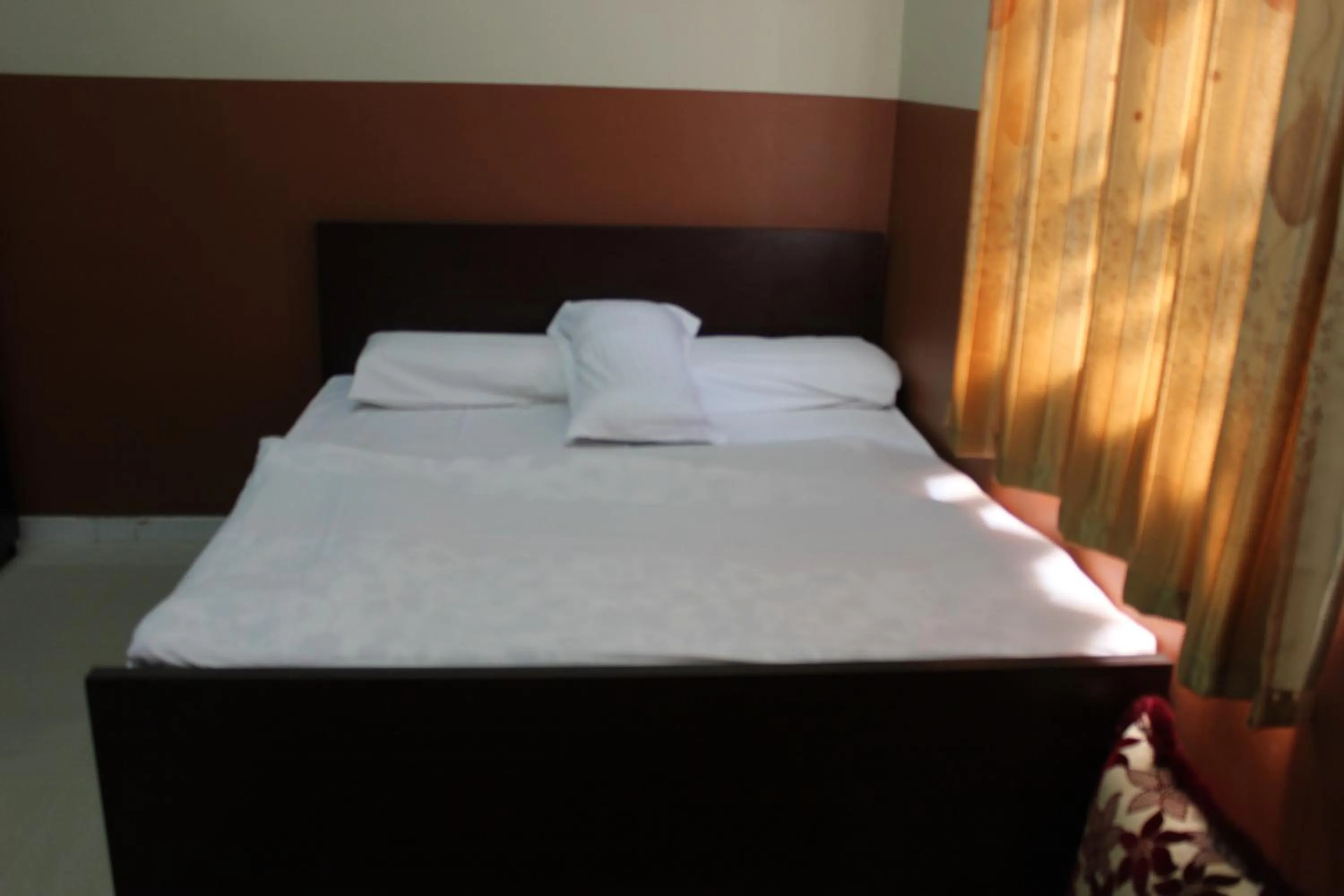 Bed in Five Continents Hotel
