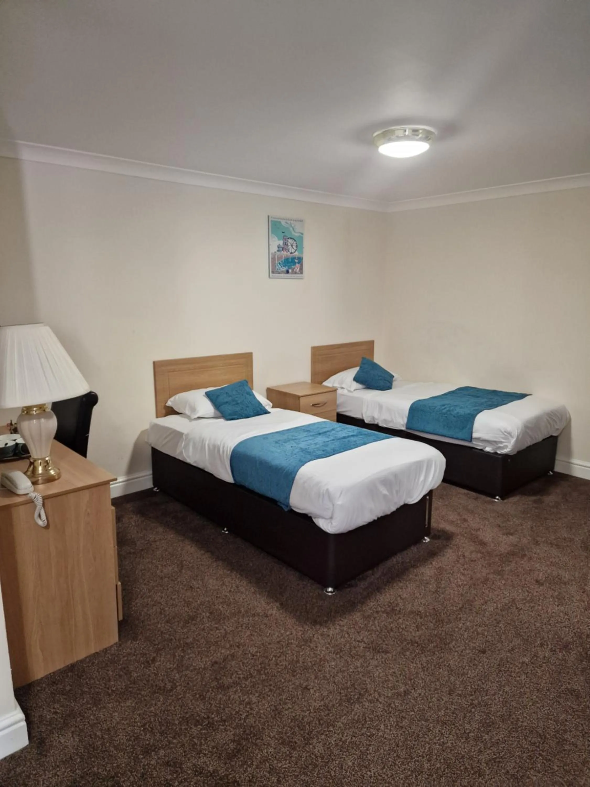 Bed in Royal Court Hotel