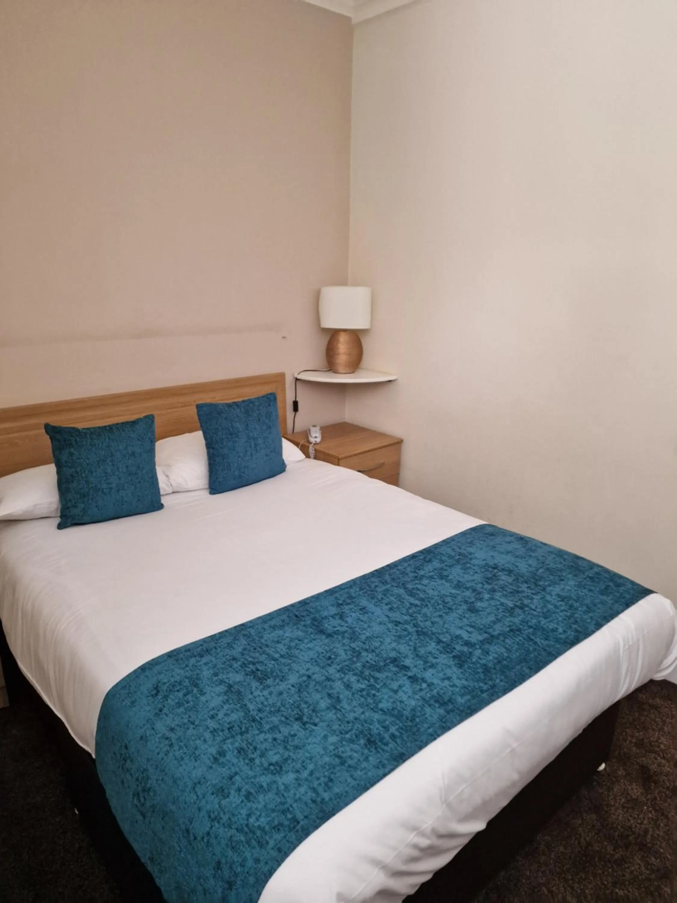 Bed in Royal Court Hotel