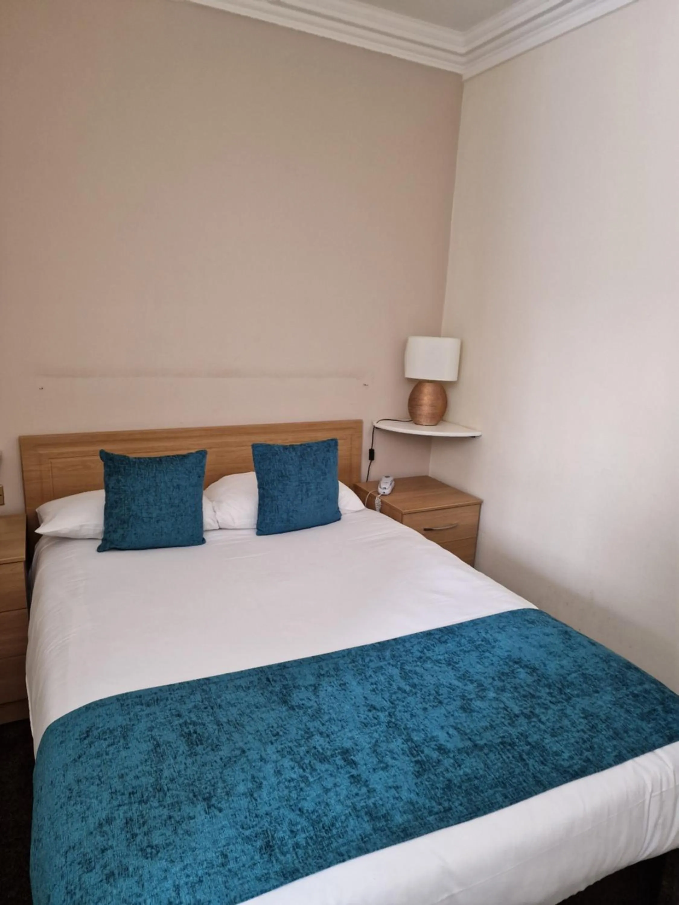 Bed in Royal Court Hotel