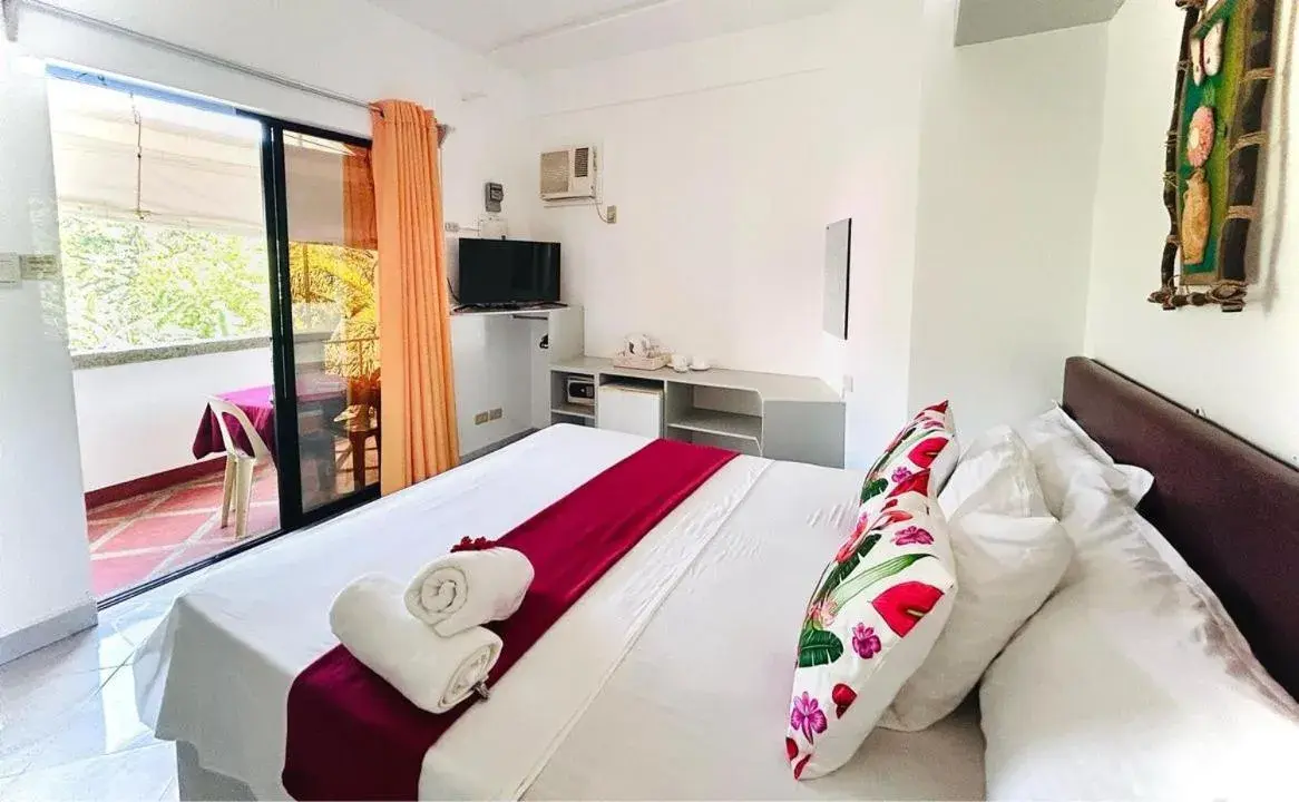 Bed in Moonlight Breeze Inn Boracay Bed in Moonlight Breeze Inn Boracay