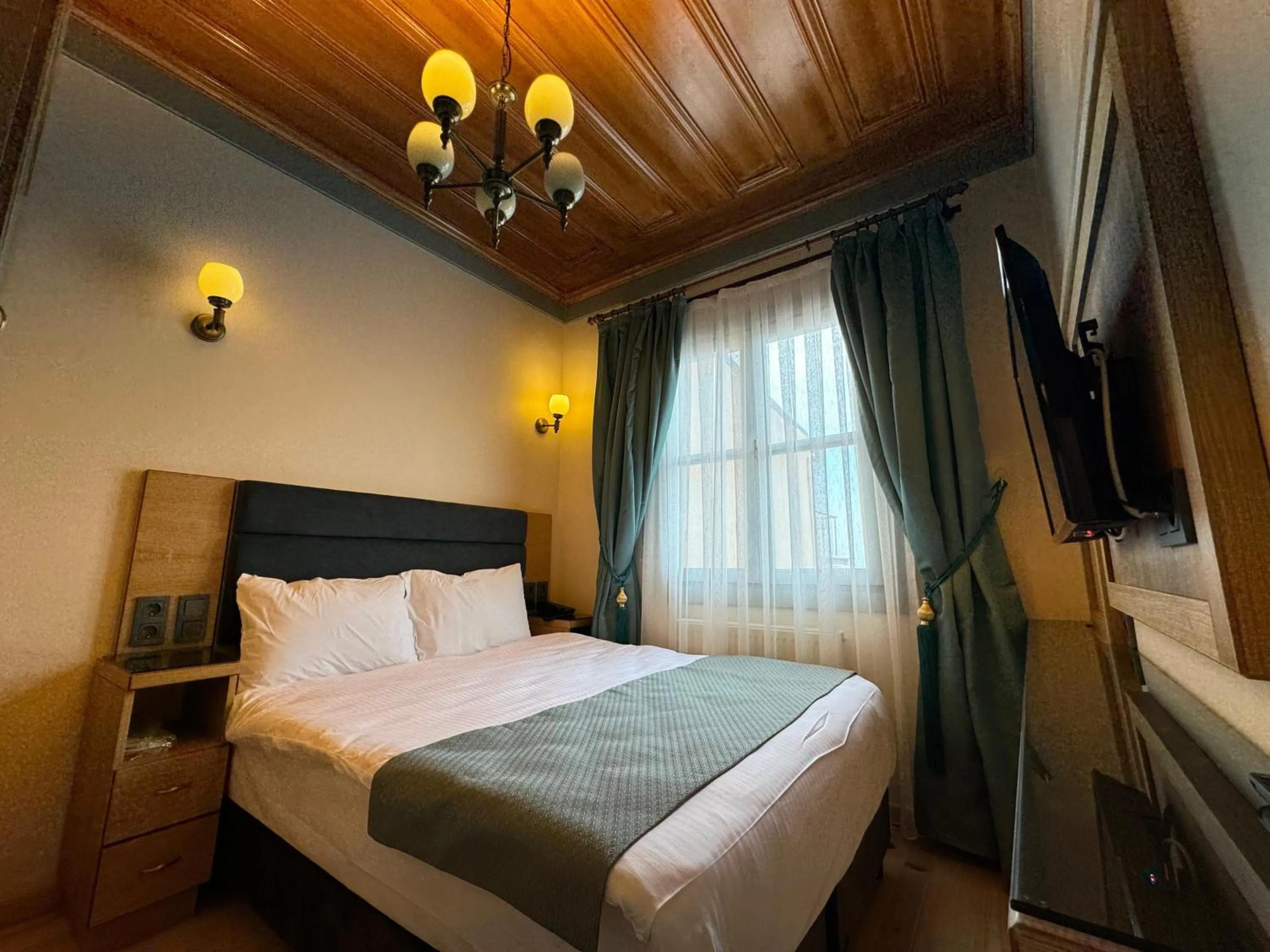 Bed in Abelia Mansion Hotel