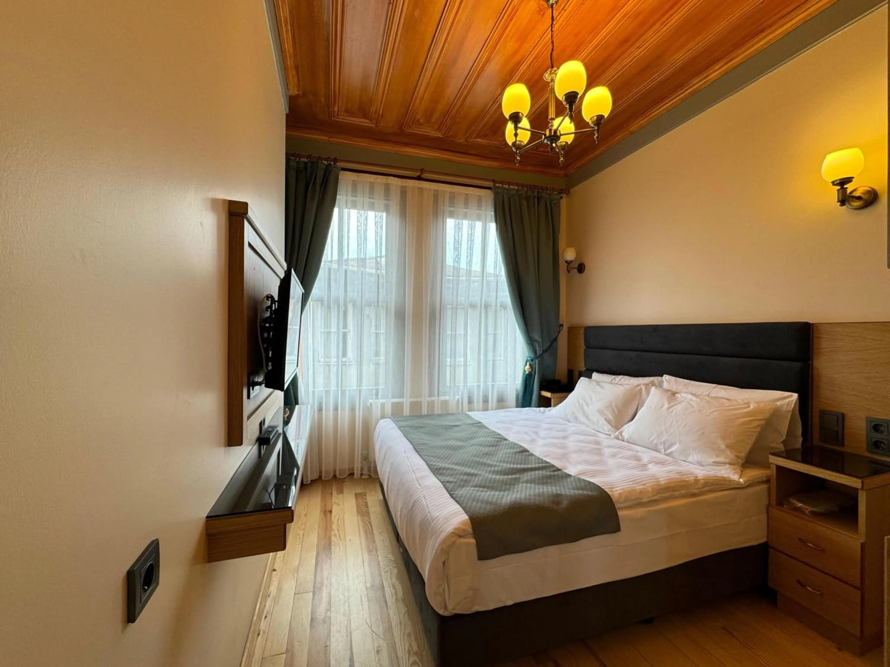 Bed in Abelia Mansion Hotel