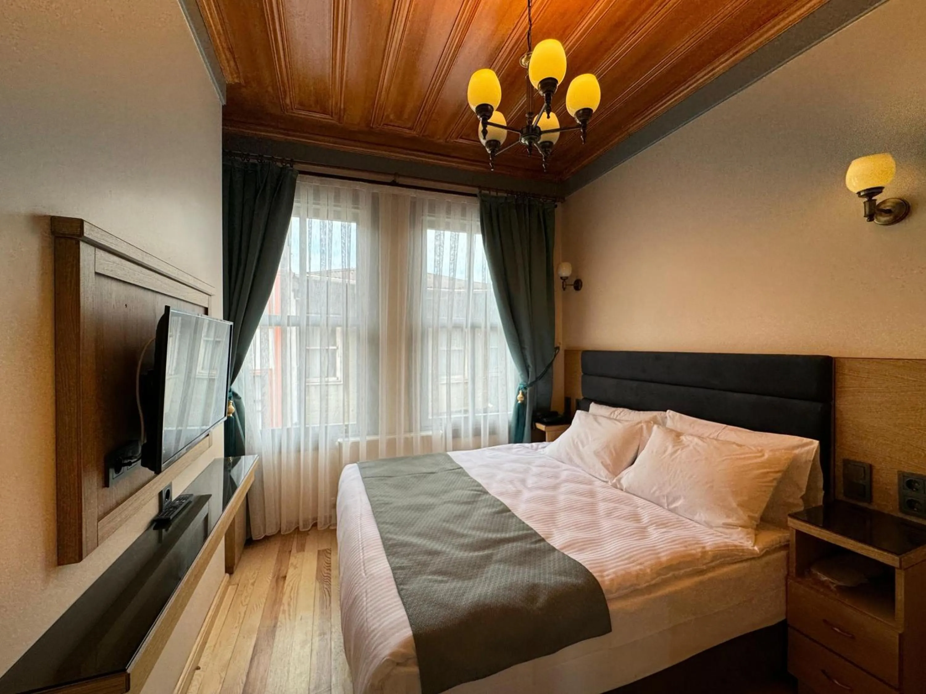 Bed in Abelia Mansion Hotel