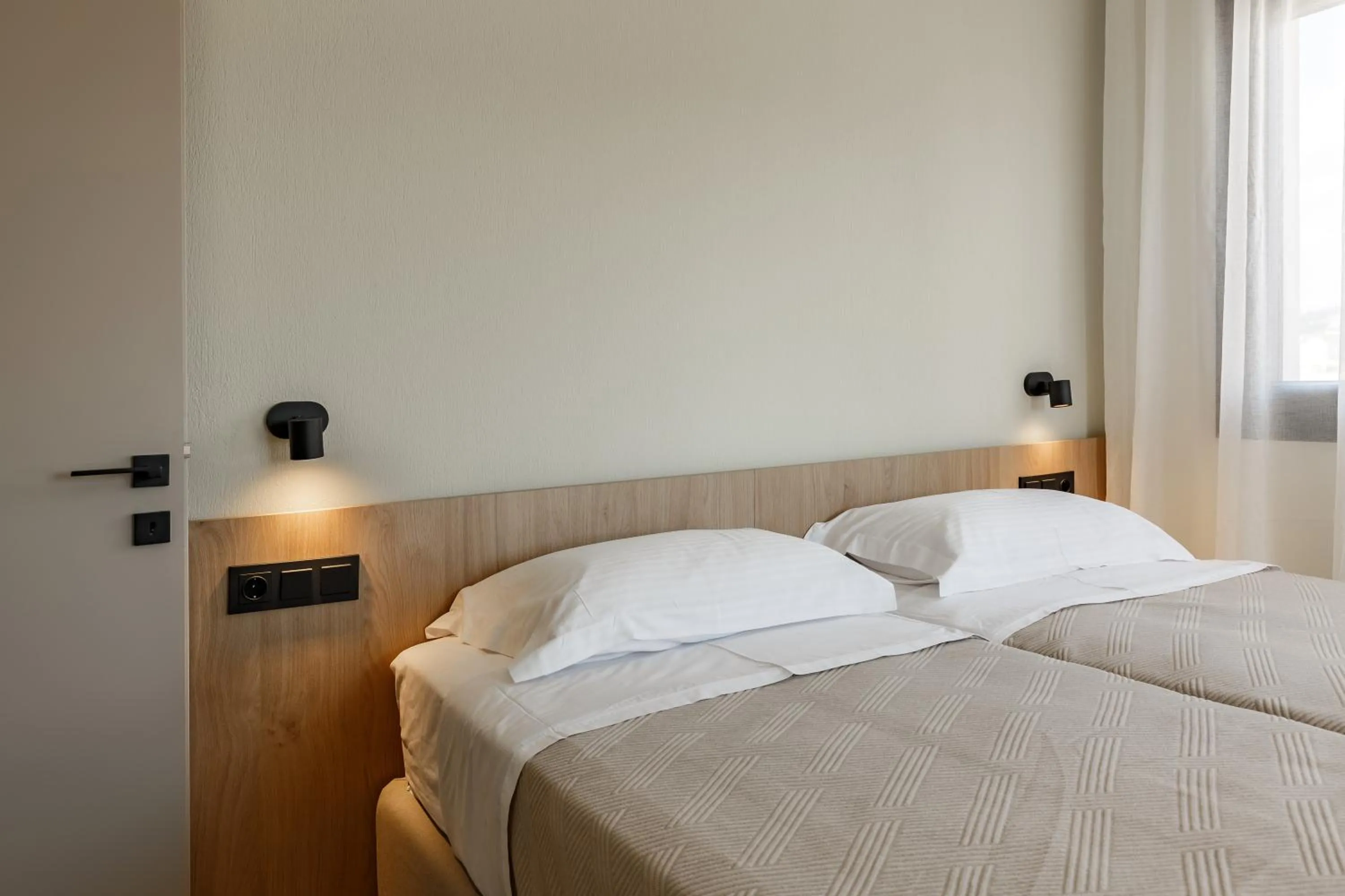 Bed in Dimi Residence