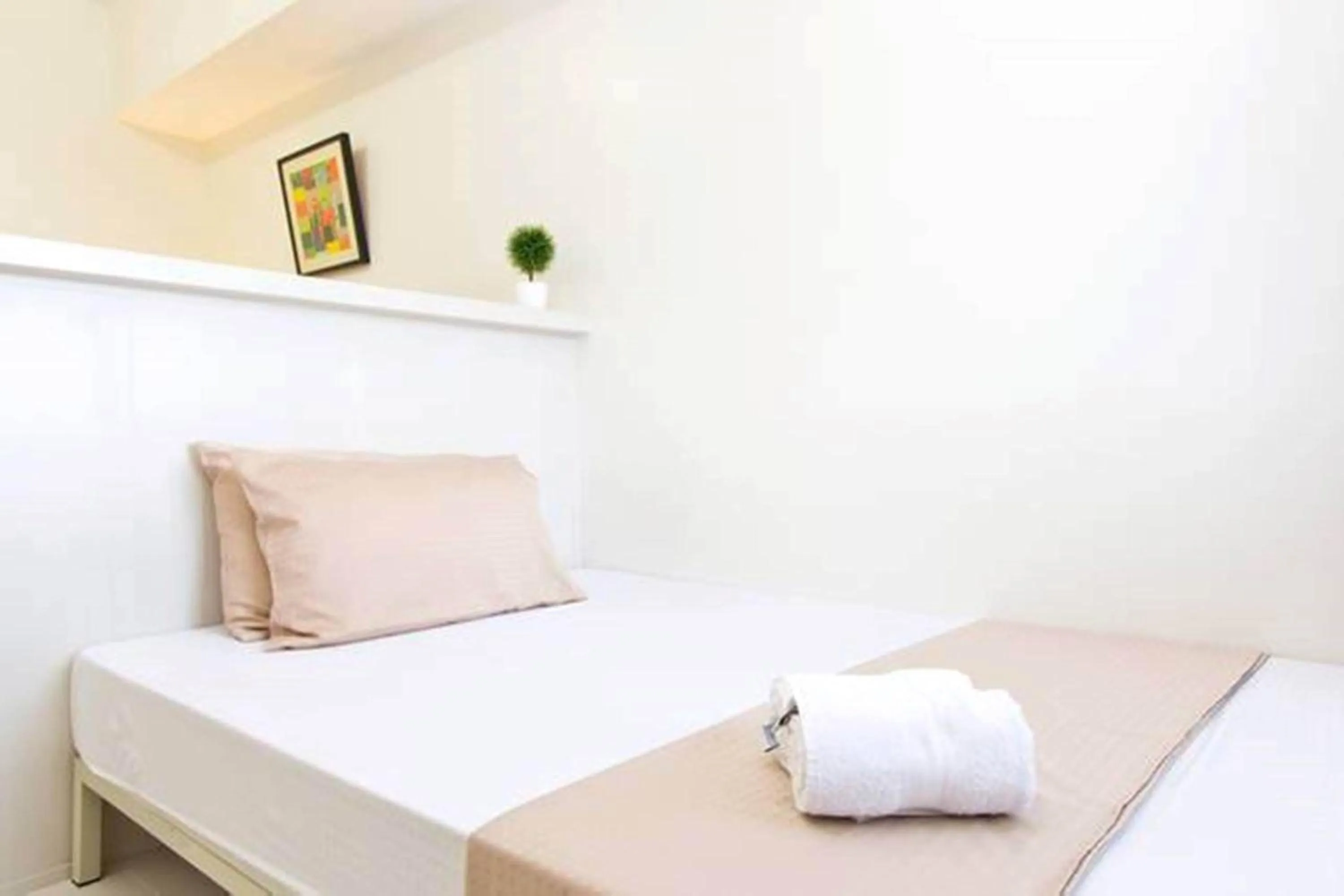 Bed in Condo Studio Luxe in Princeton Residences