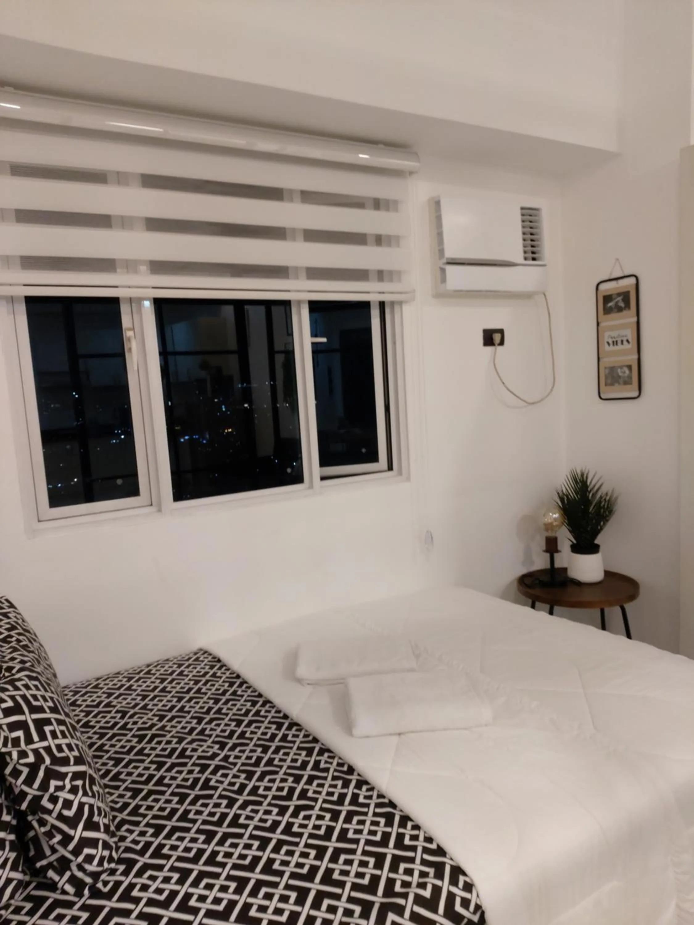 Bed in Condo Studio Luxe in Princeton Residences