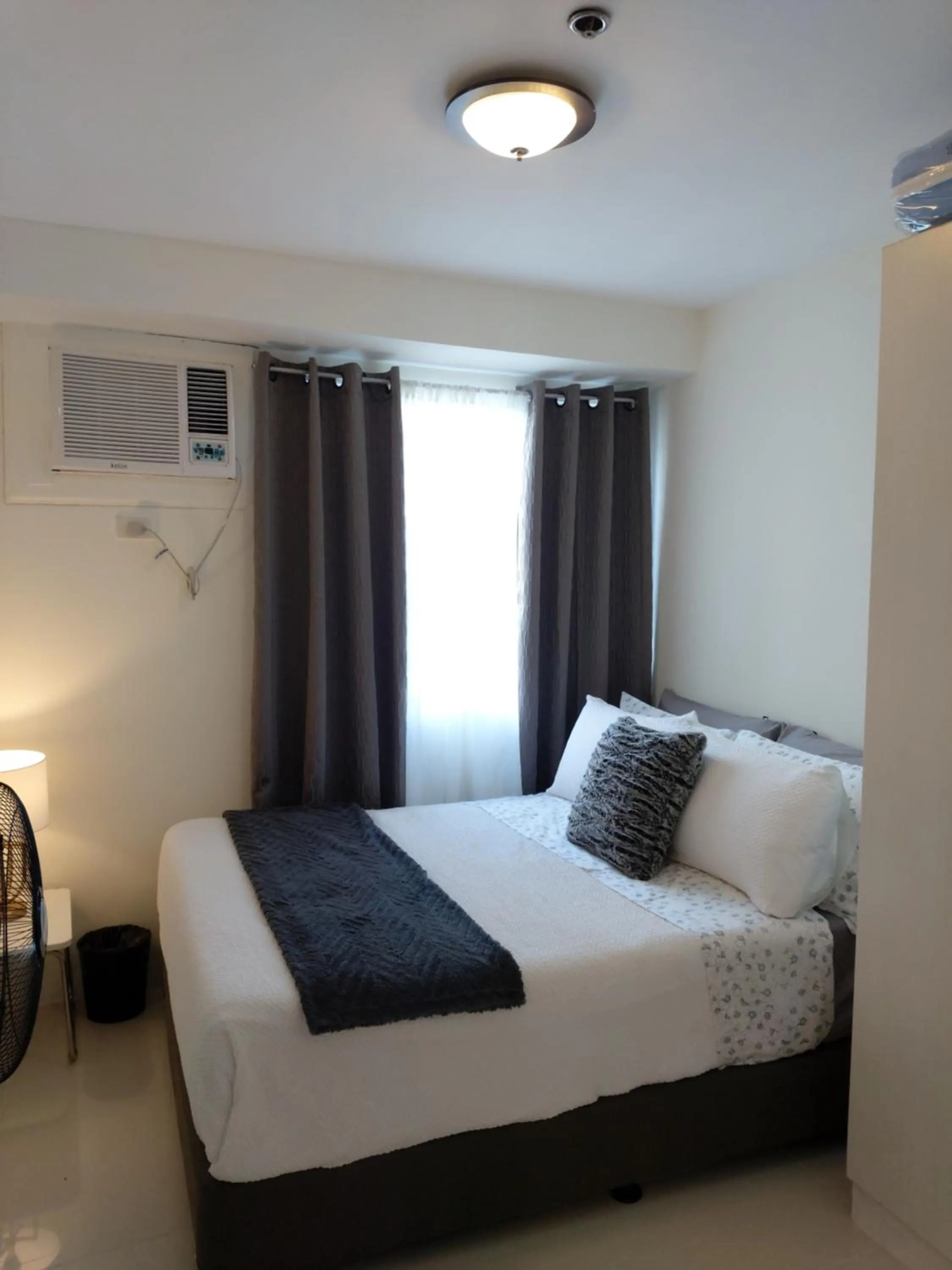 Bed in Condo Studio Luxe in Princeton Residences