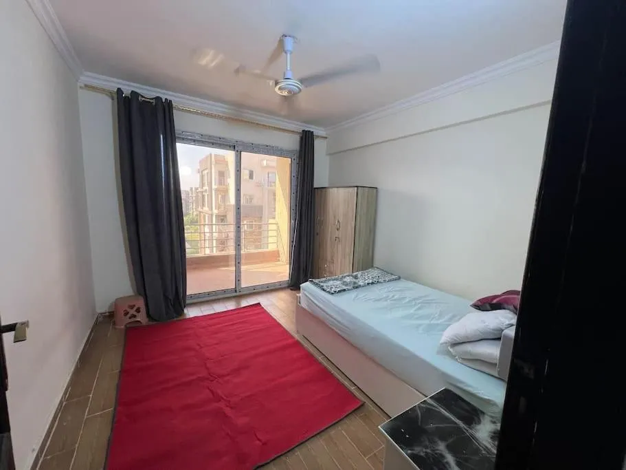 Bed in Garden view 3 BR 2 balconies in compound
