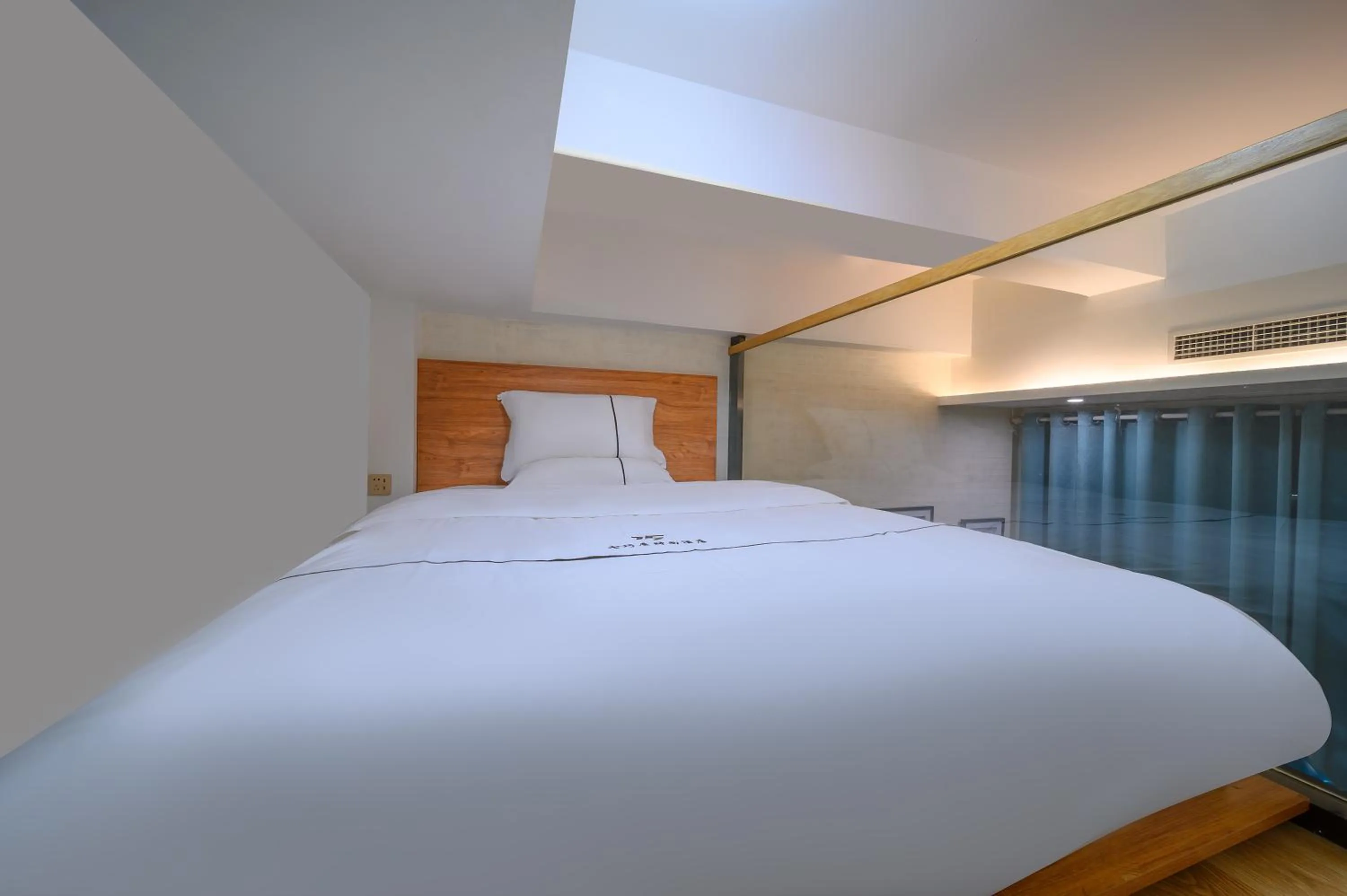 Bed in QiQiaoWu Fashion Hotel - Beijing Songjiazhuang Subway Station