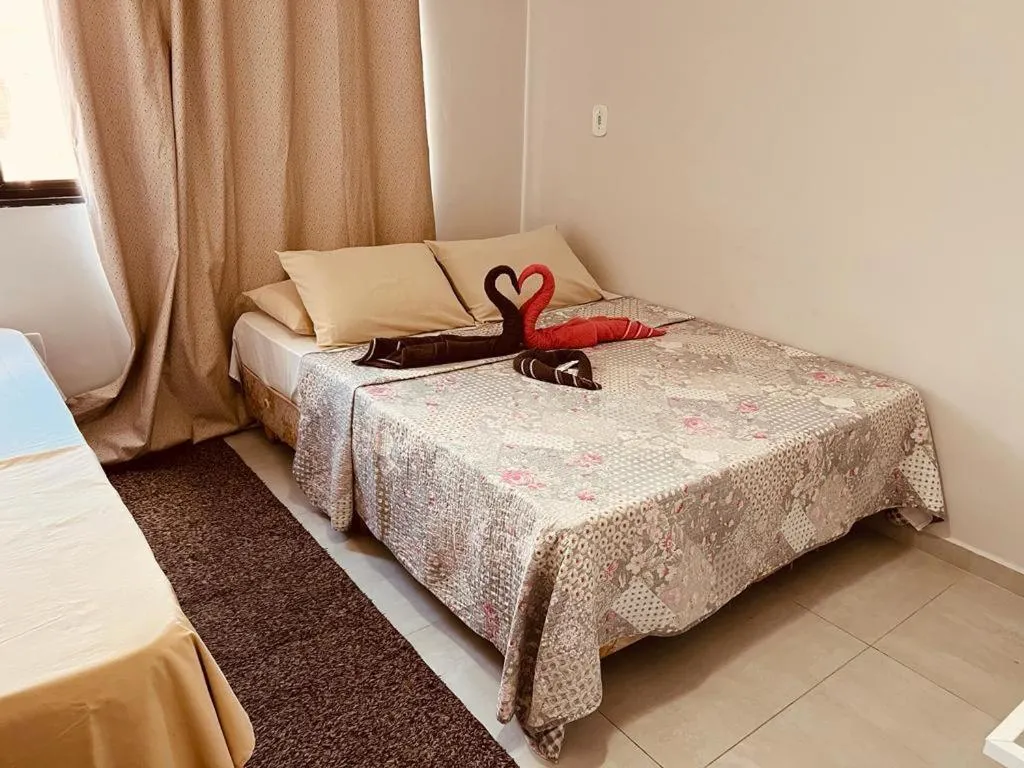 Bed in Pousada Garoupa