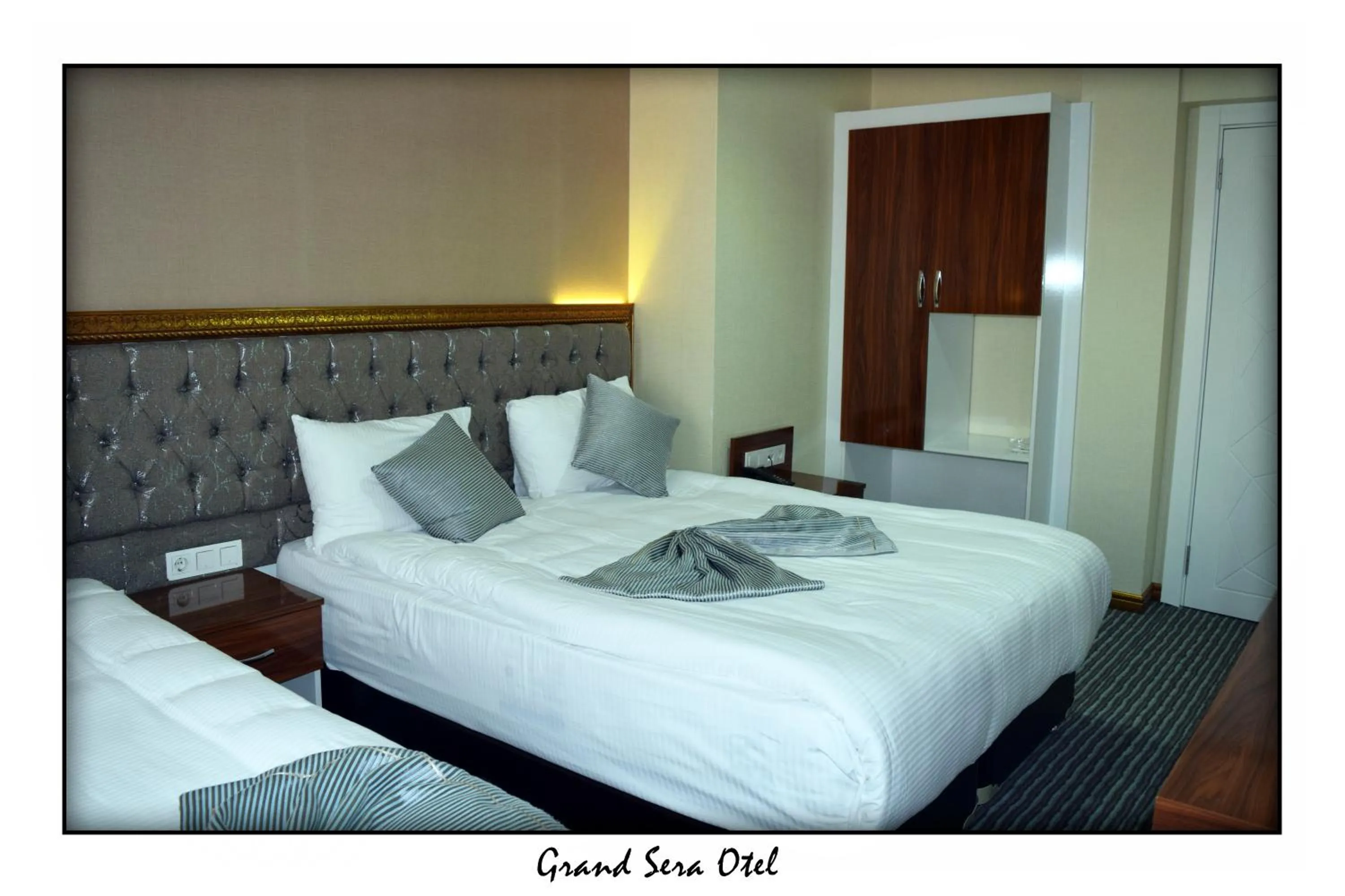 Text overlay, Bed in Grand Sera Hotel
