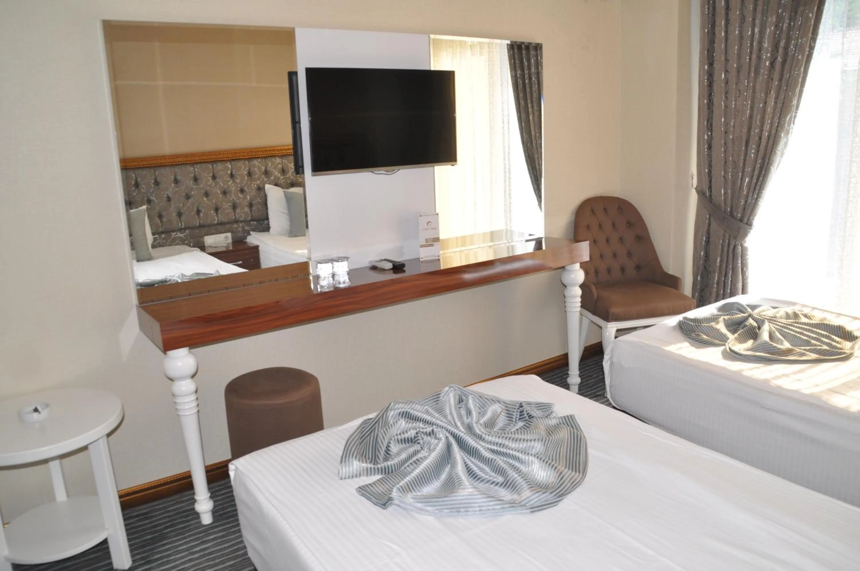 Photo of the whole room, Bed in Grand Sera Hotel