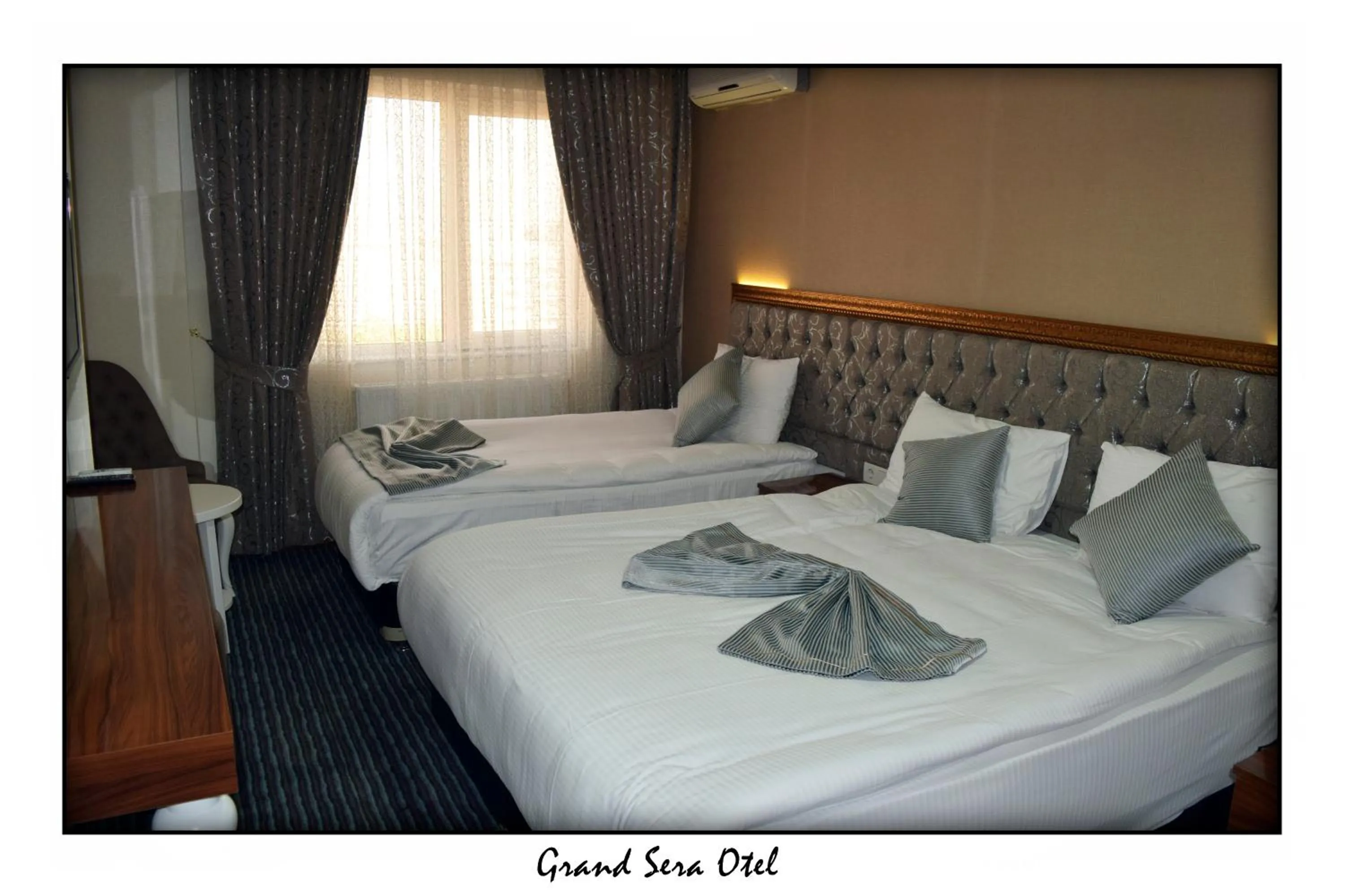 Text overlay, Bed in Grand Sera Hotel