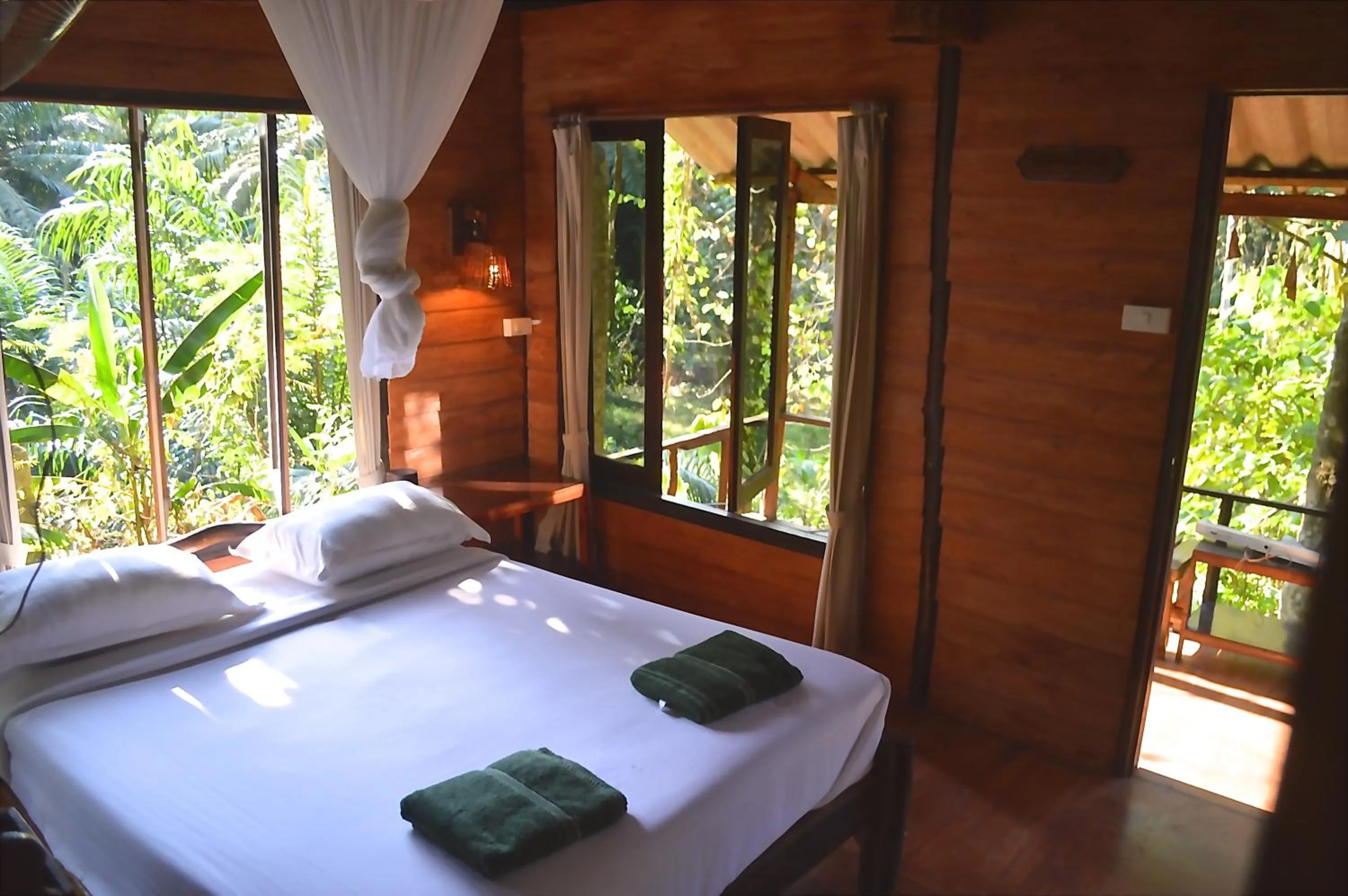 Bedroom, Bed in Khao Sok Riverside Cottages