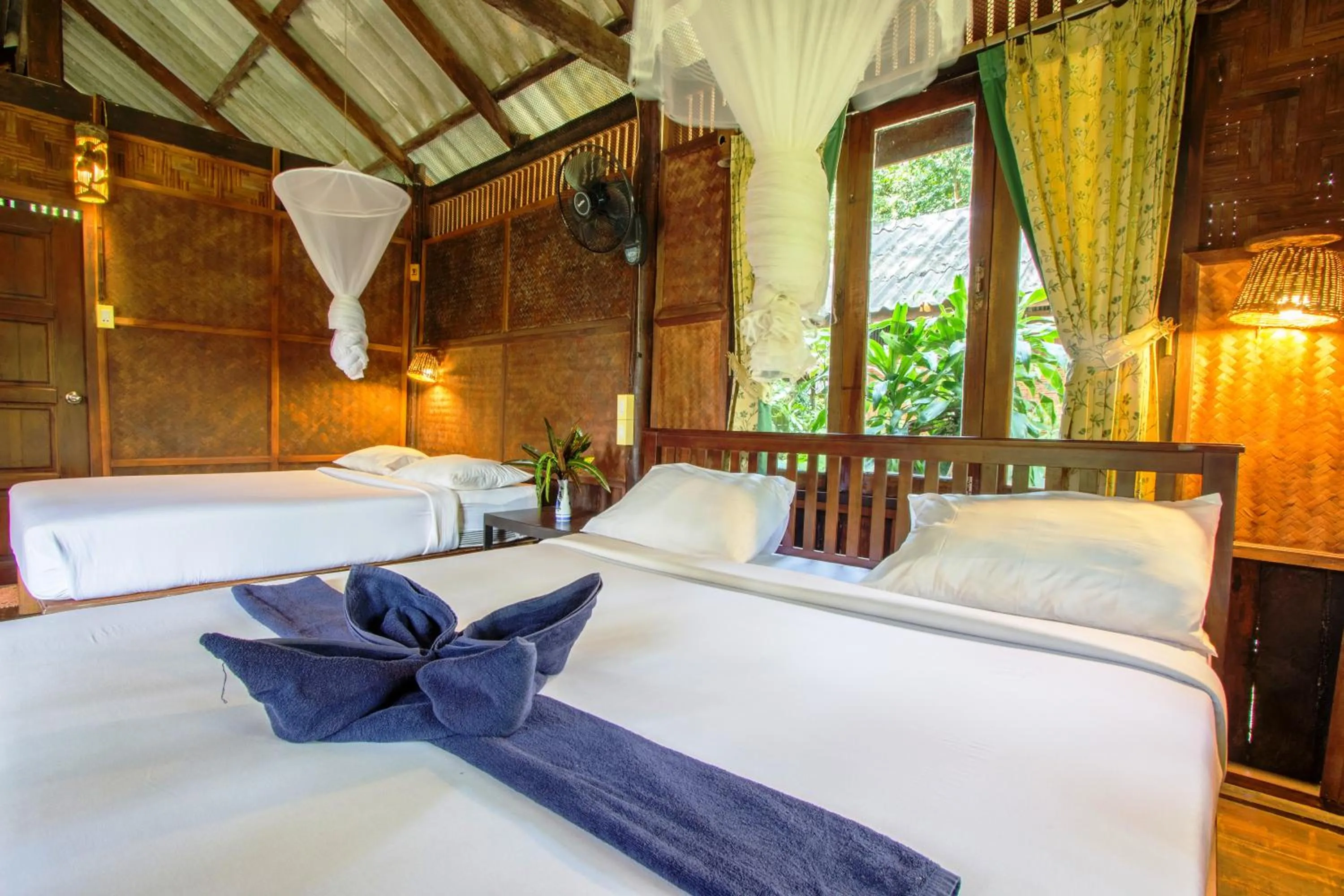 Photo of the whole room, Bed in Khao Sok Riverside Cottages