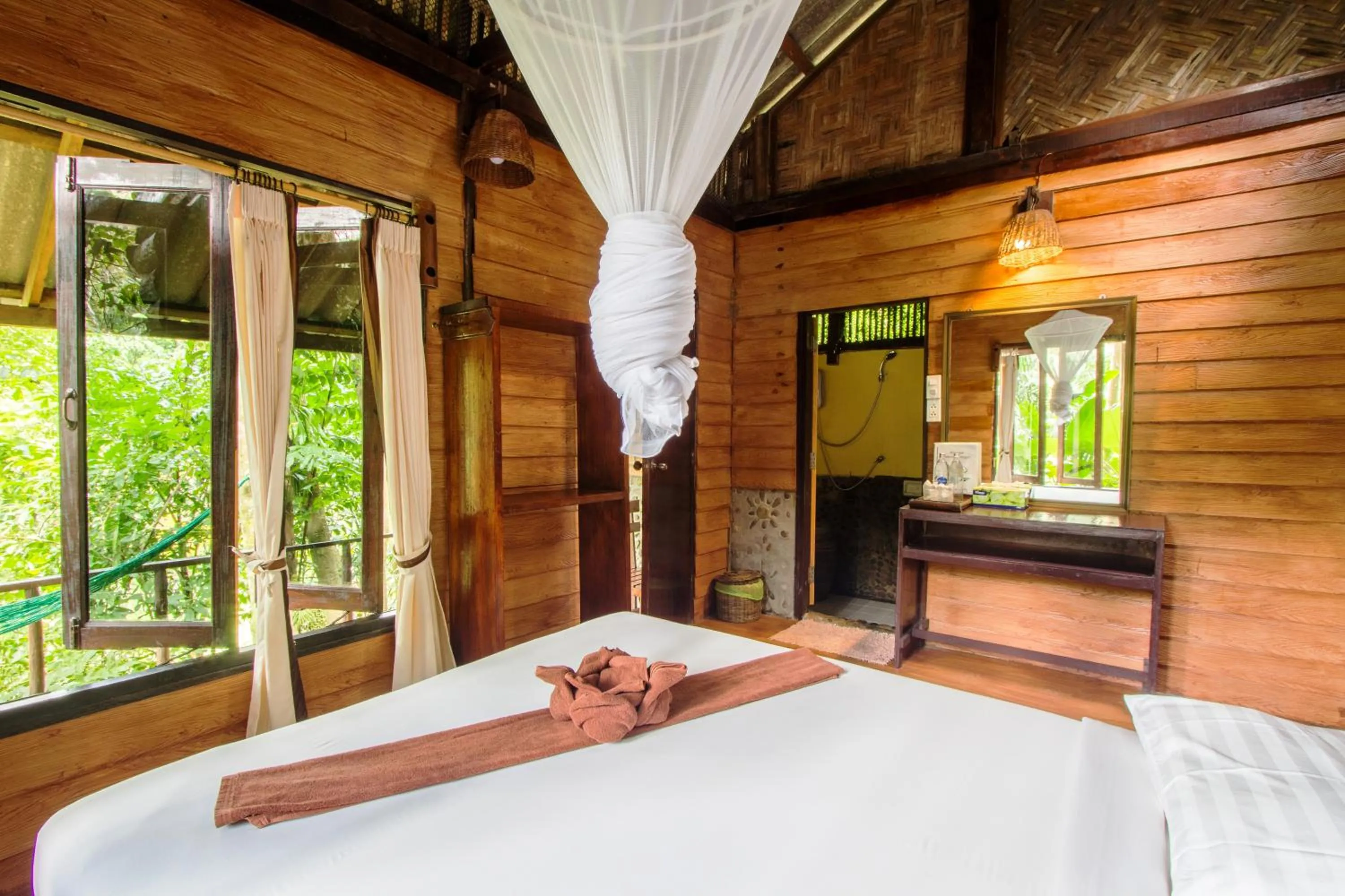 Photo of the whole room, Bed in Khao Sok Riverside Cottages