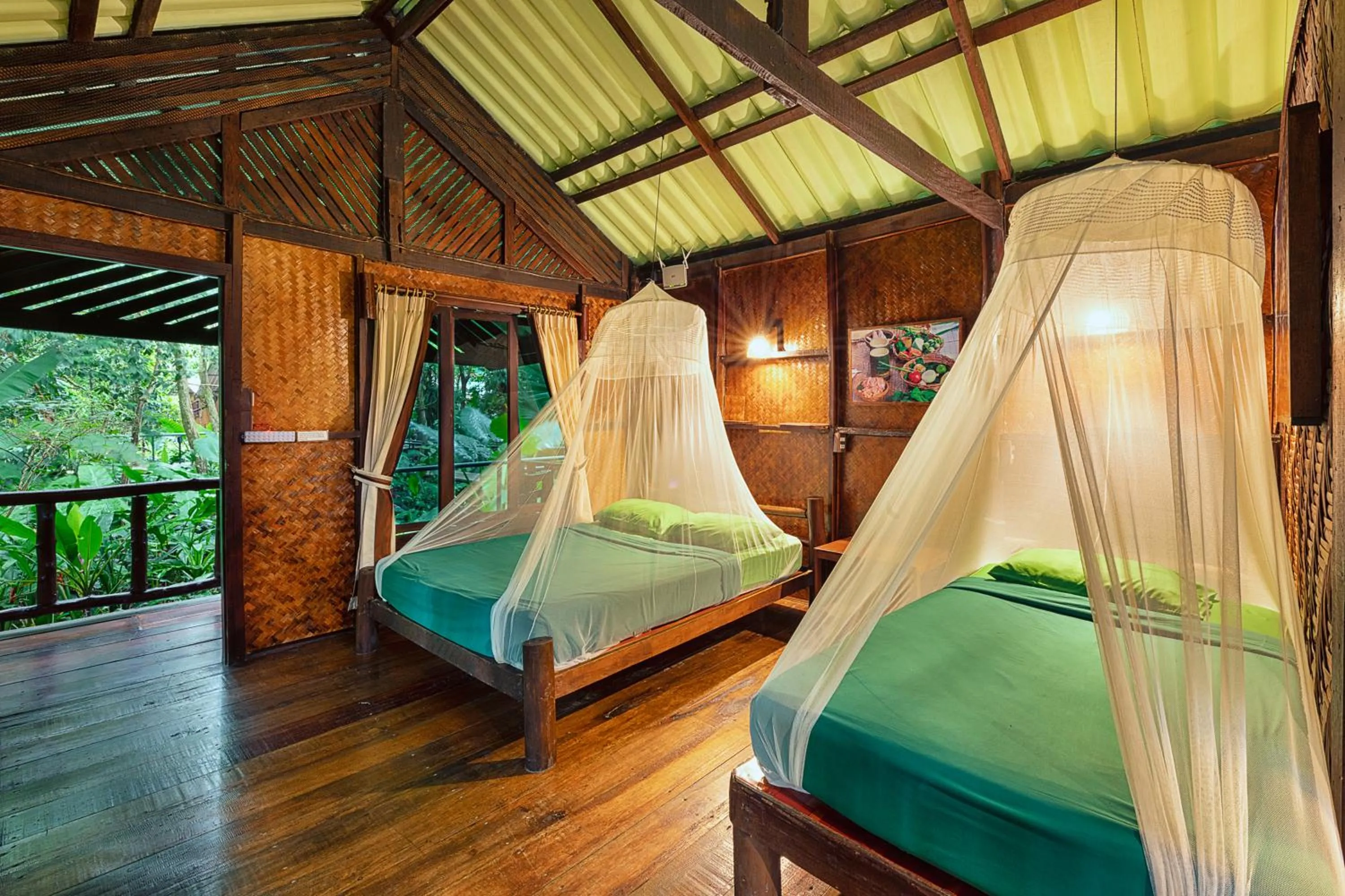 Bed in Khao Sok Riverside Cottages