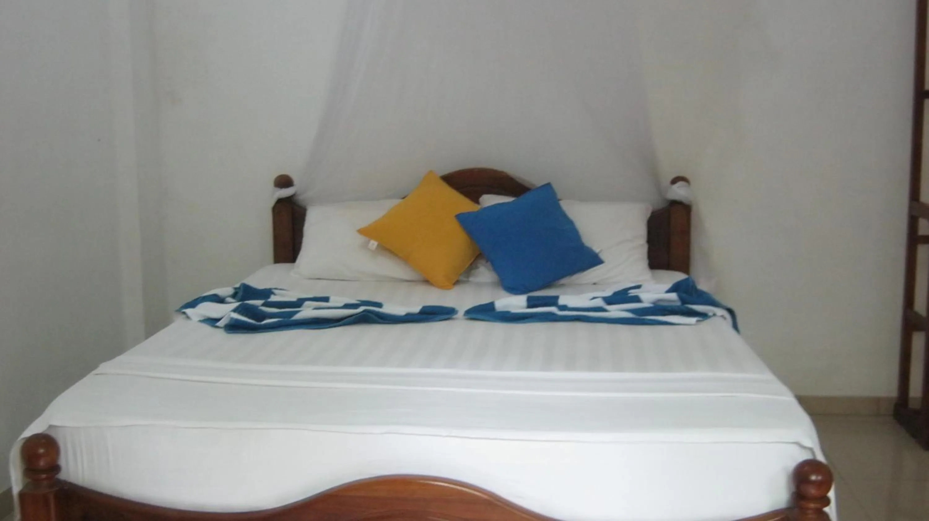 Bed in Arcade Beach Hotel