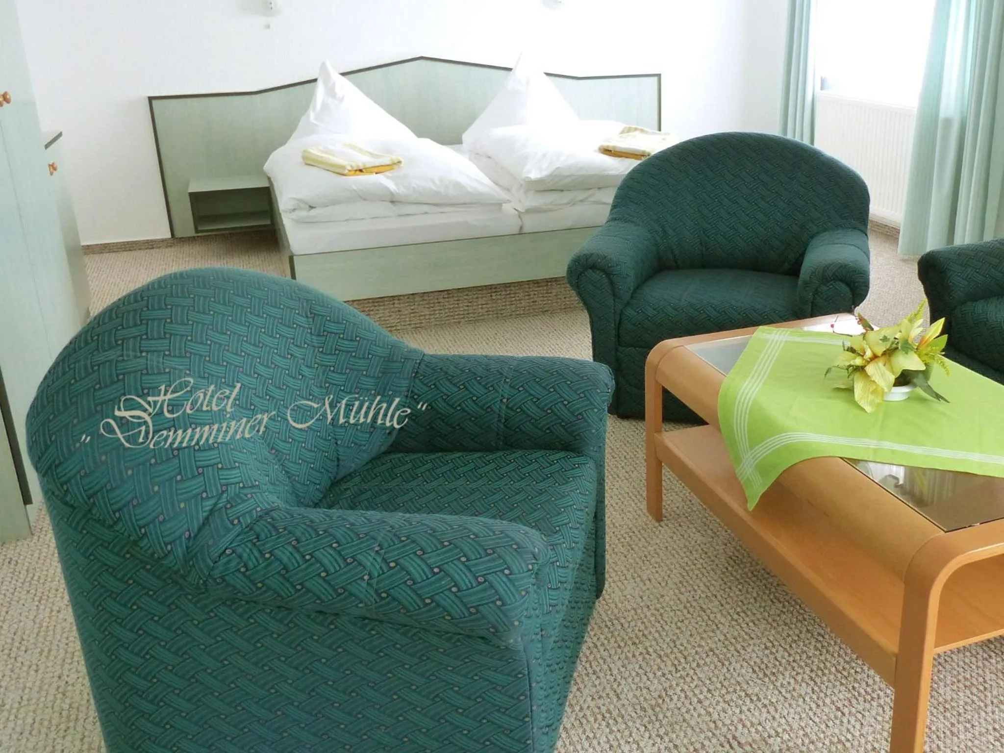 Seating area, Bed in Hotel Demminer Mühle