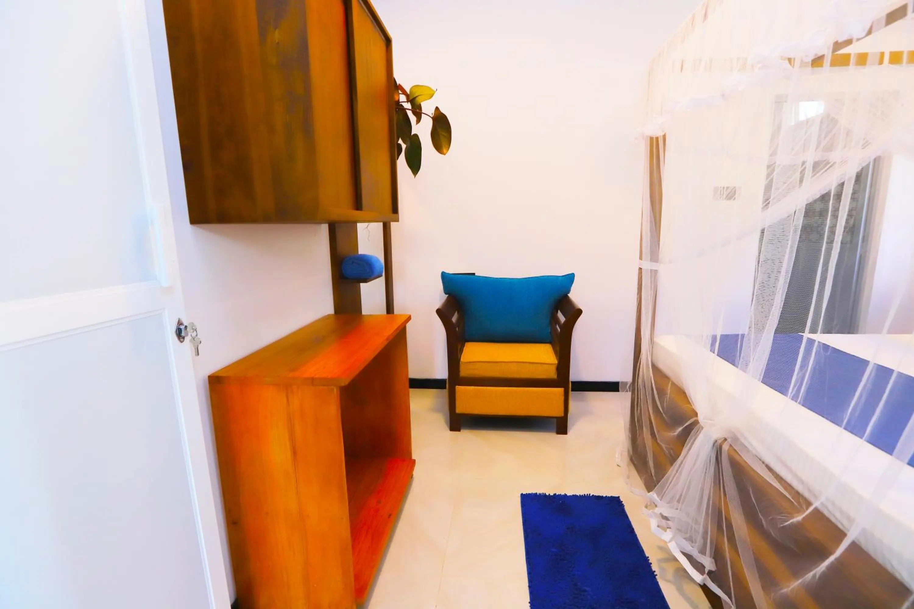 Seating area, Bed in Dinsara Pearl Villa