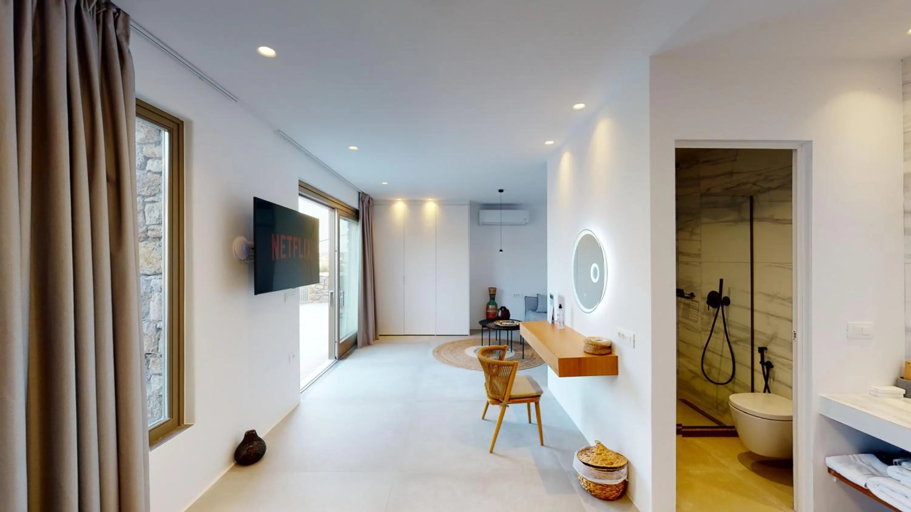 TV and multimedia in Nasta Suites & Villas Intentional Living Mykonos