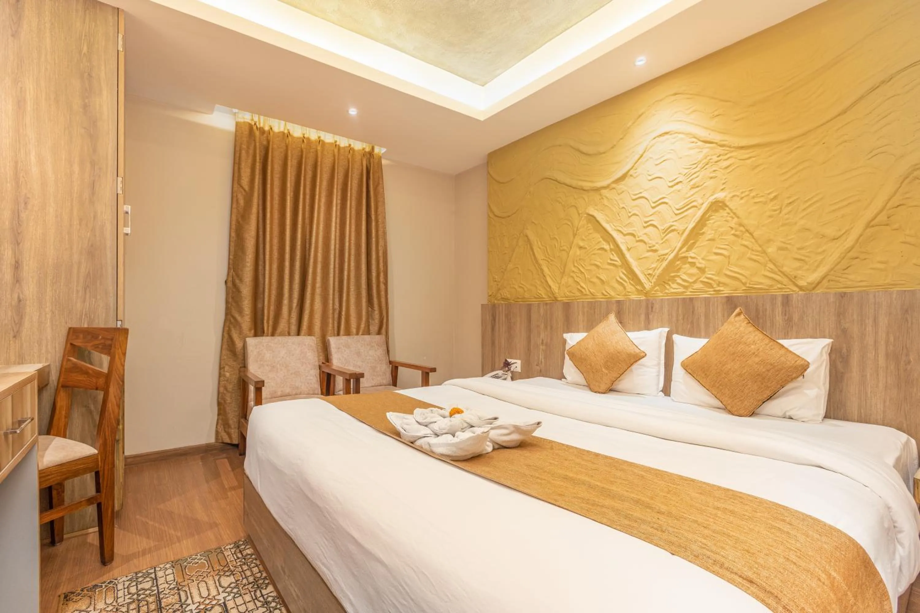 Bed in Divya Boutique Inn